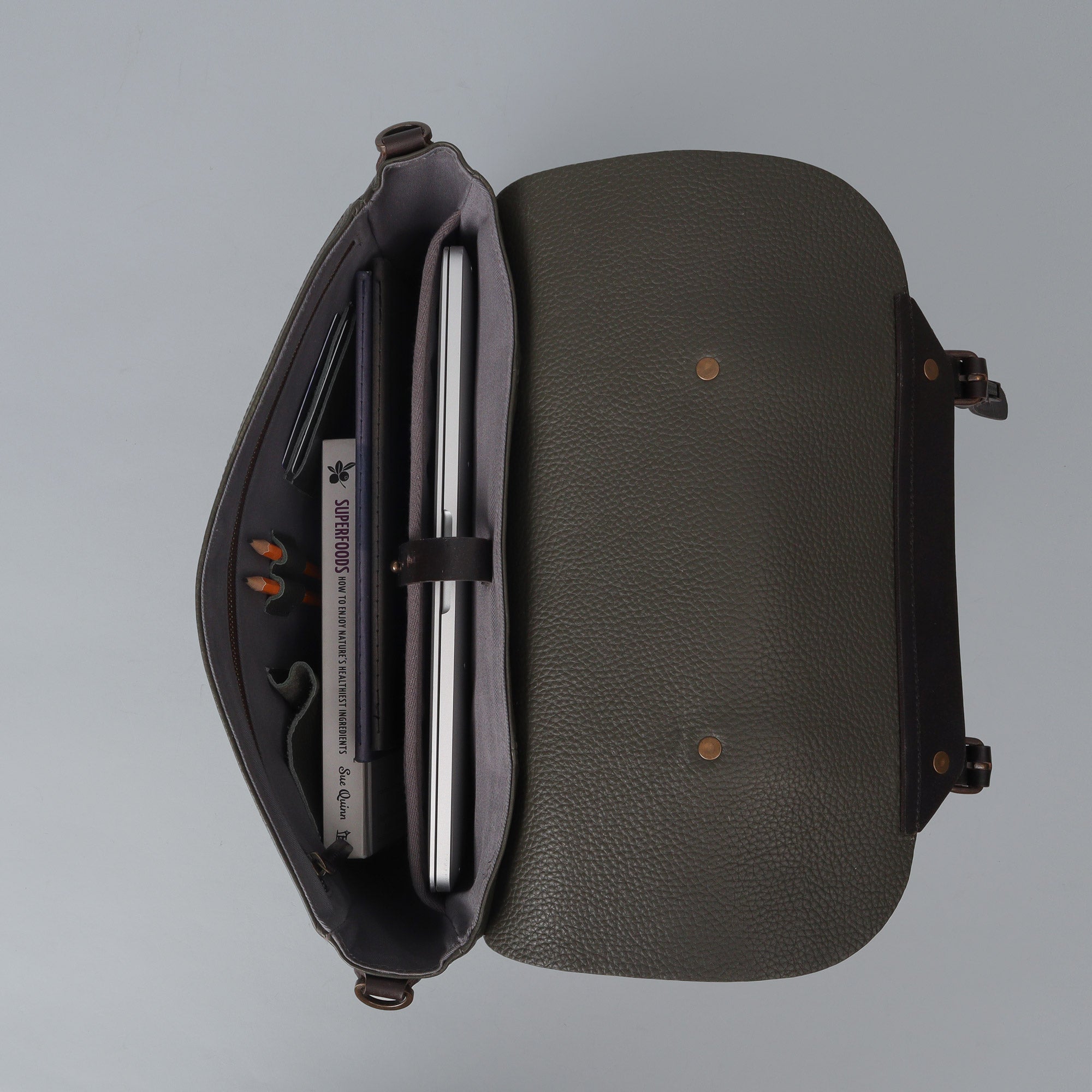 Oslo Leather Briefcase showcasing premium full grain leather, spacious compartments, and a comfortable shoulder strap.