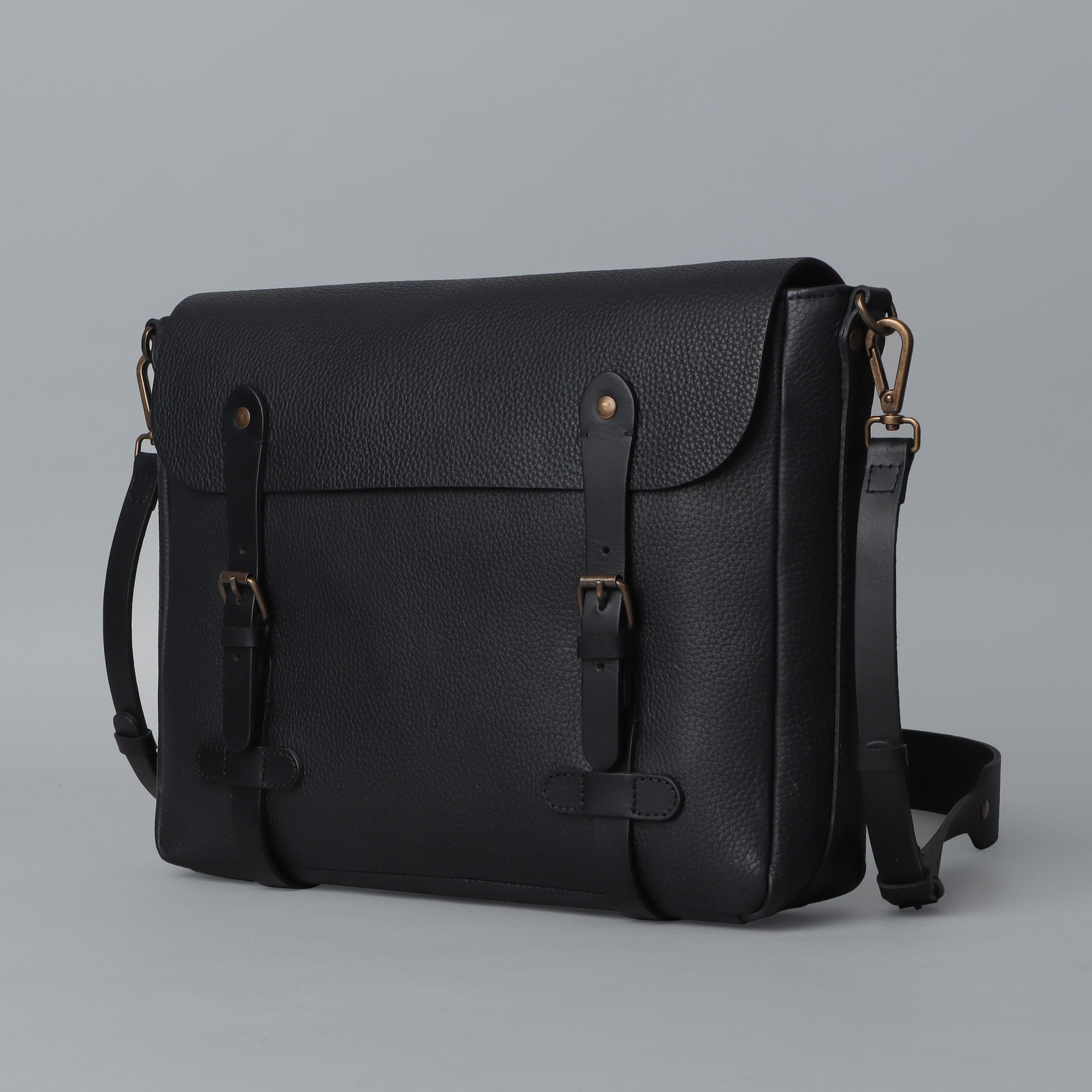 Oslo Leather Messenger Bag made from premium full grain leather, featuring a separate laptop section, zipper pocket, and comfortable shoulder strap.