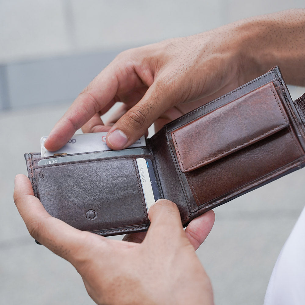 Oxford Billfold Wallet in Coffee color with coin pocket and tab closure, showcasing its compact and stylish design.
