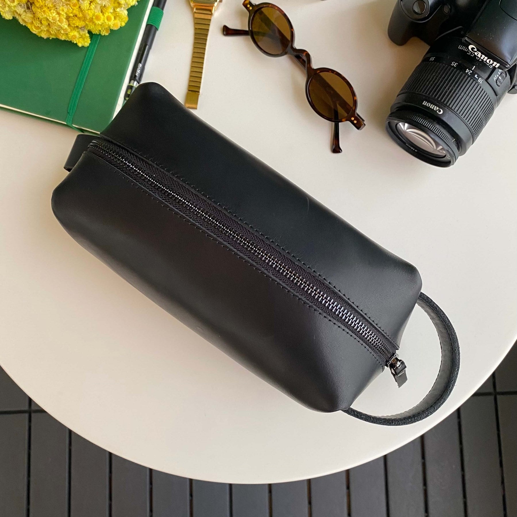 Partenon Genuine Leather Dopp Kit in various colors, showcasing its elegant design and zipper feature.