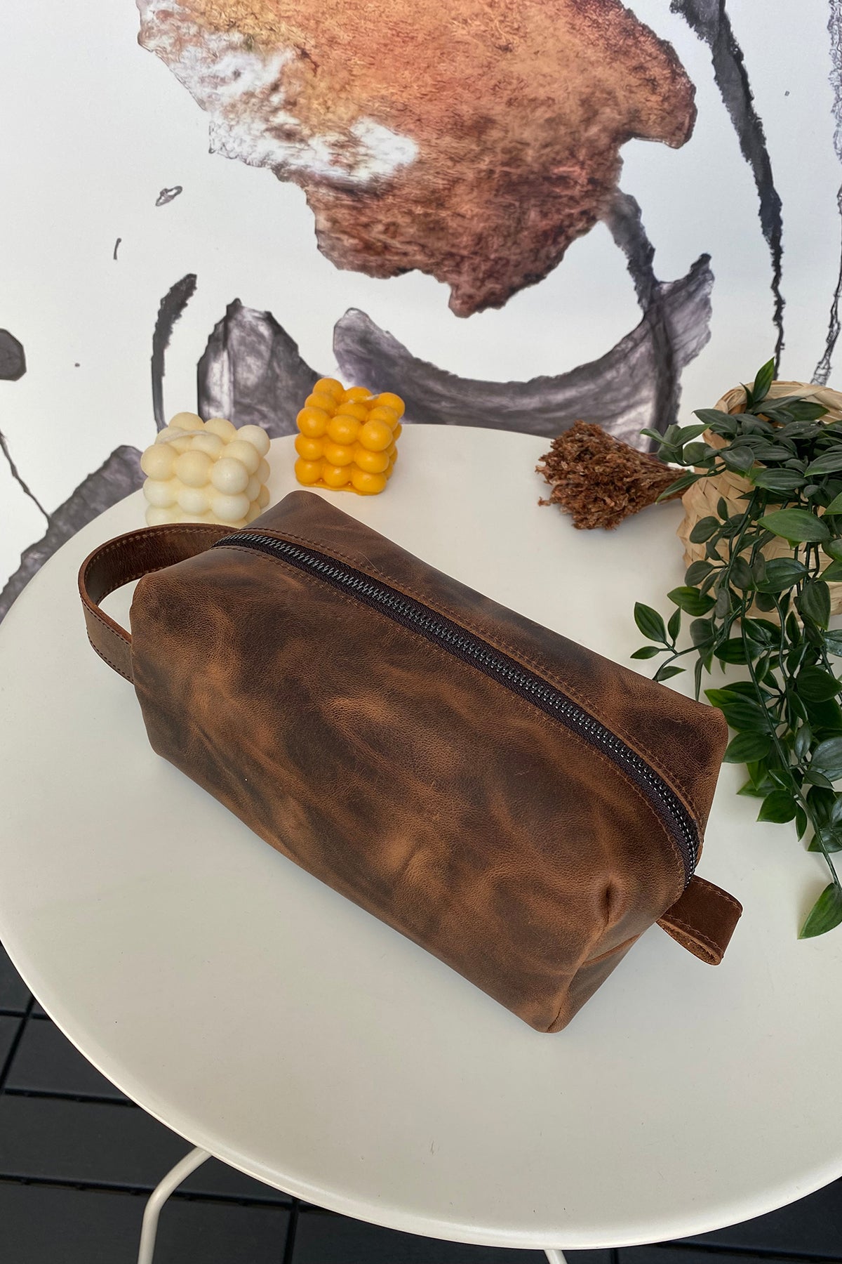 Partenon Genuine Leather Dopp Kit in various colors, showcasing its elegant design and zipper feature.