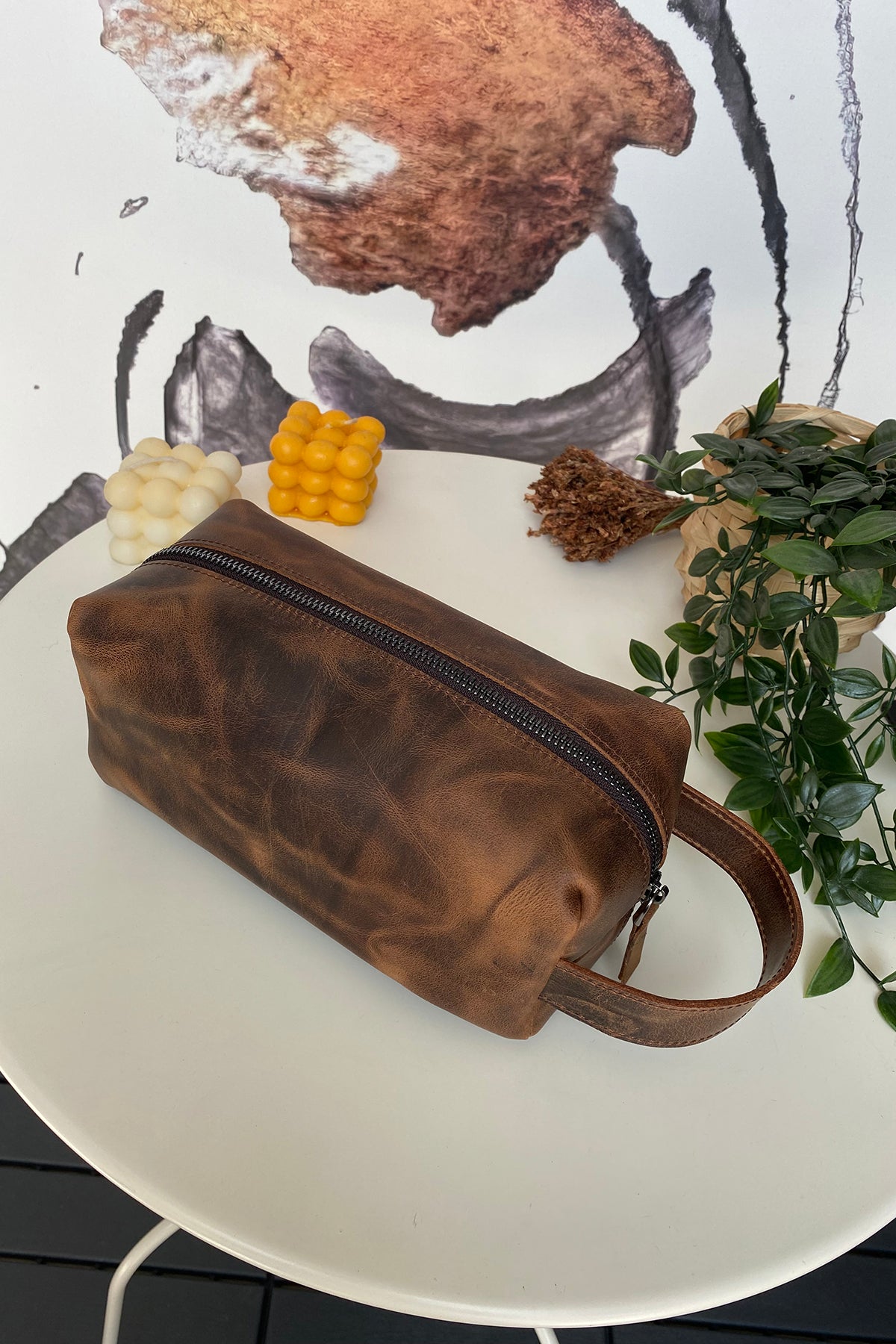 Partenon Genuine Leather Dopp Kit in various colors, showcasing its elegant design and zipper feature.