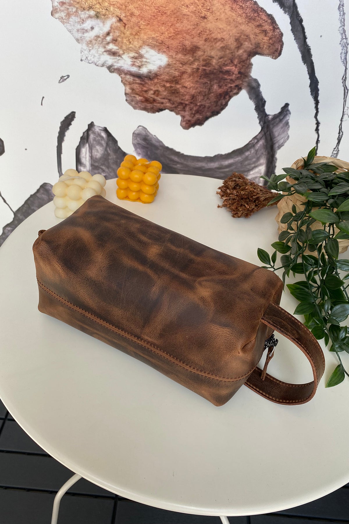 Partenon Genuine Leather Dopp Kit in various colors, showcasing its elegant design and zipper feature.