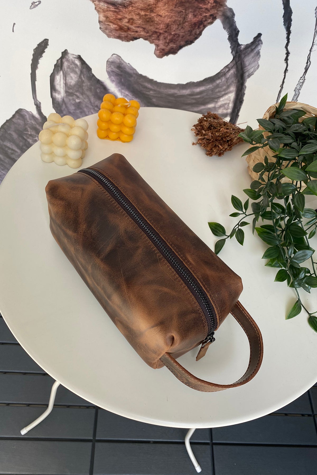 Partenon Genuine Leather Dopp Kit in various colors, showcasing its elegant design and zipper feature.