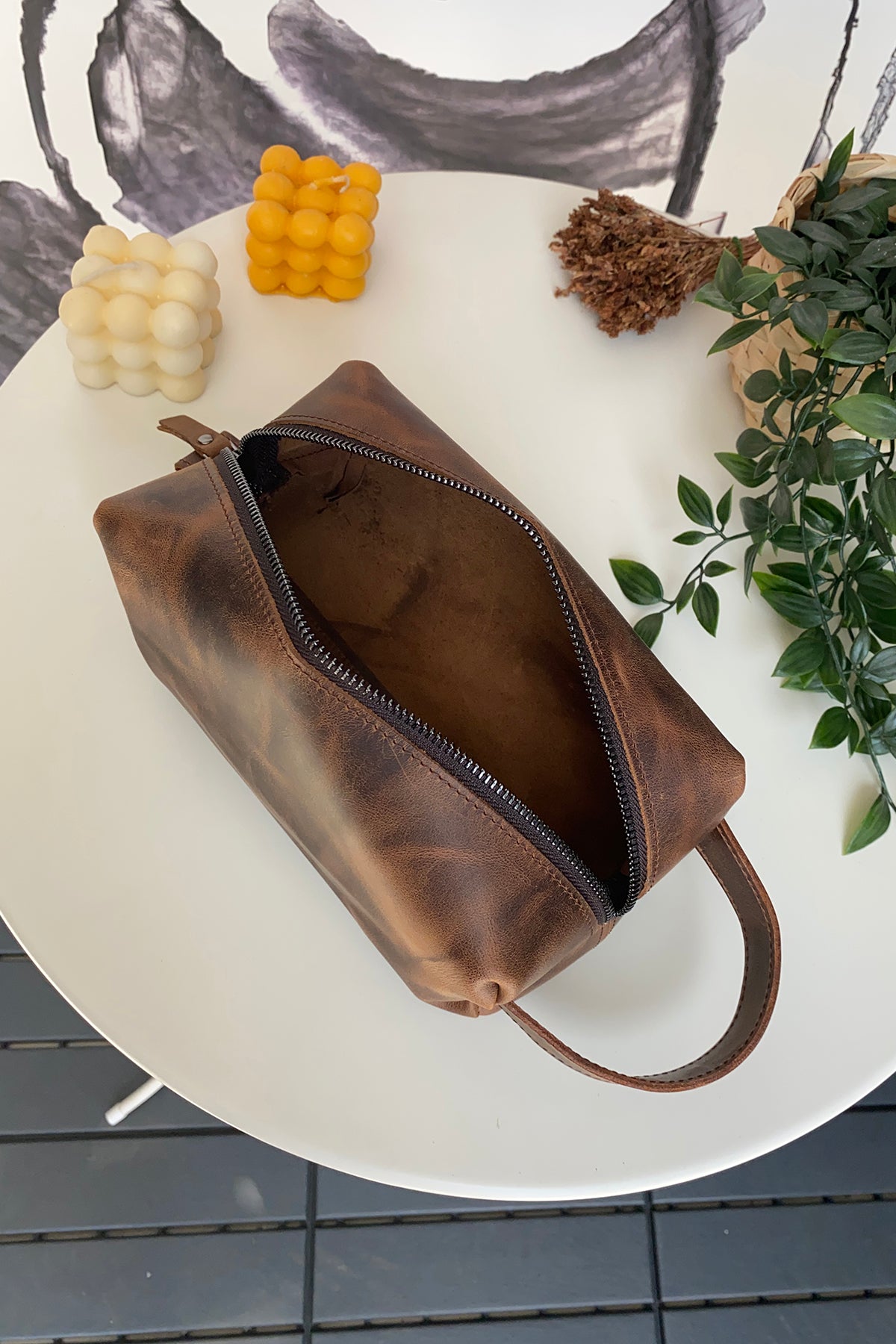 Partenon Genuine Leather Dopp Kit in various colors, showcasing its elegant design and zipper feature.