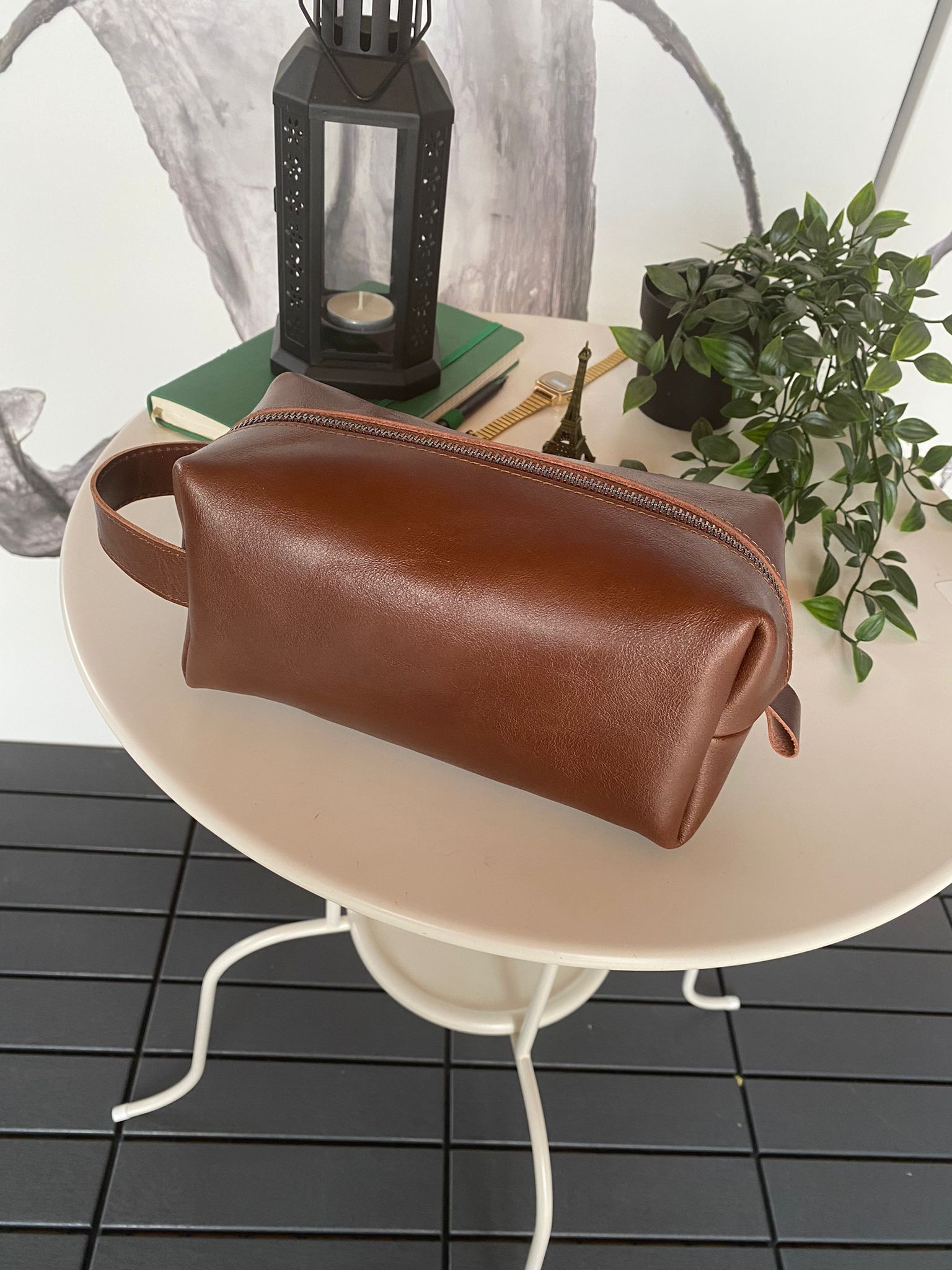 Partenon Genuine Leather Dopp Kit in various colors, showcasing its elegant design and zipper feature.