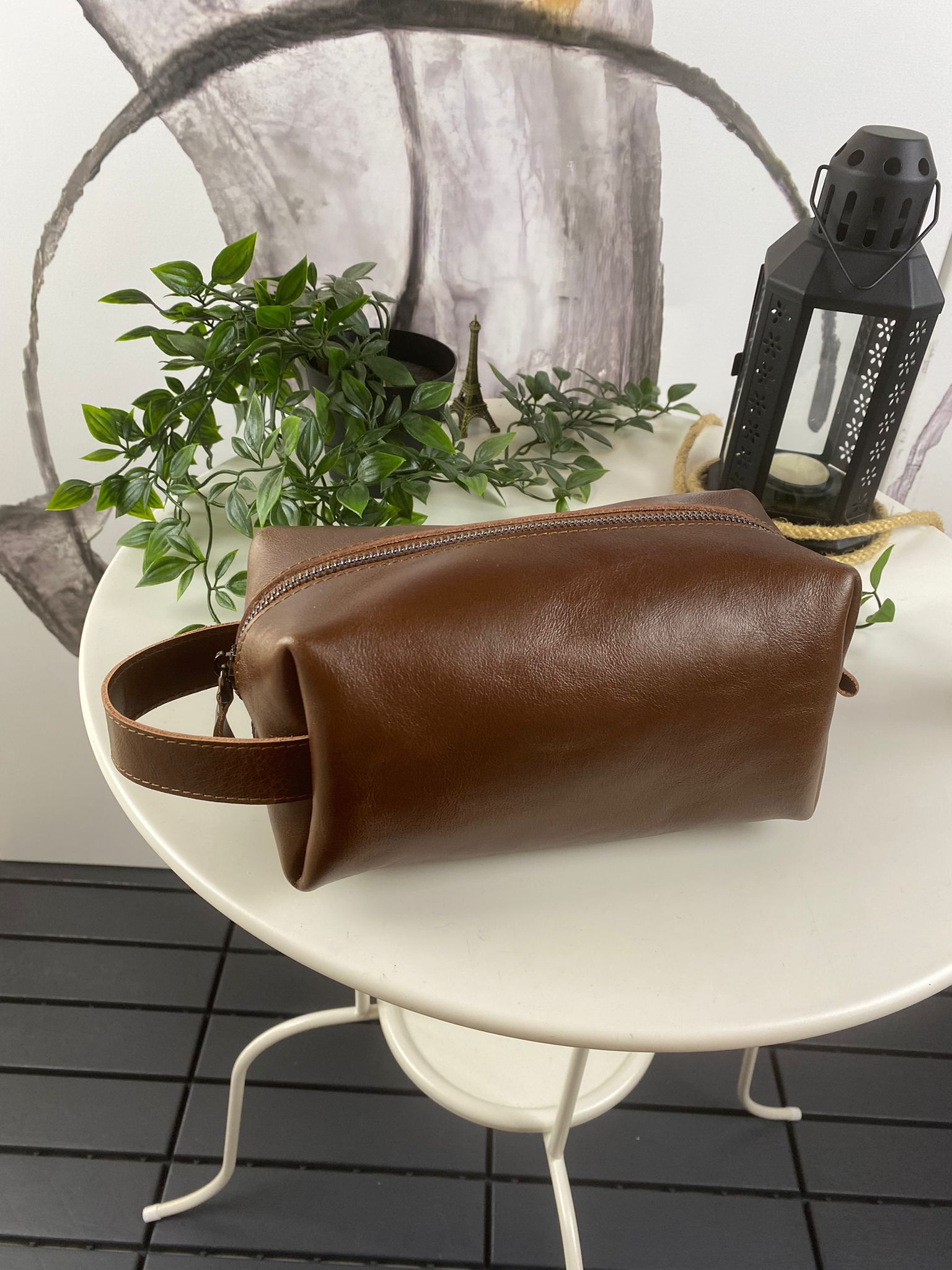 Partenon Genuine Leather Dopp Kit in various colors, showcasing its elegant design and zipper feature.