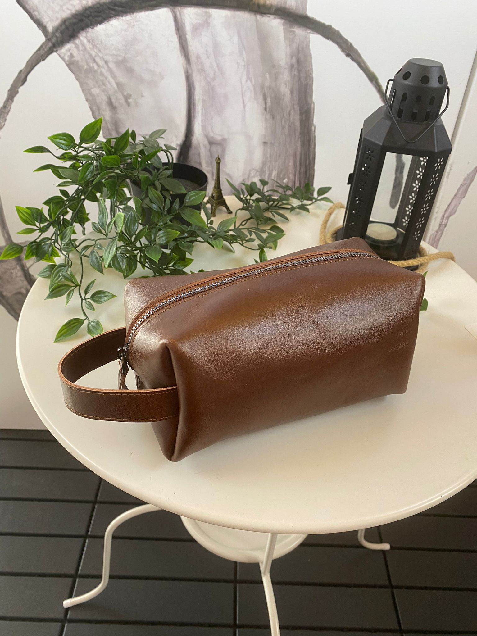 Partenon Genuine Leather Dopp Kit in various colors, showcasing its elegant design and zipper feature.