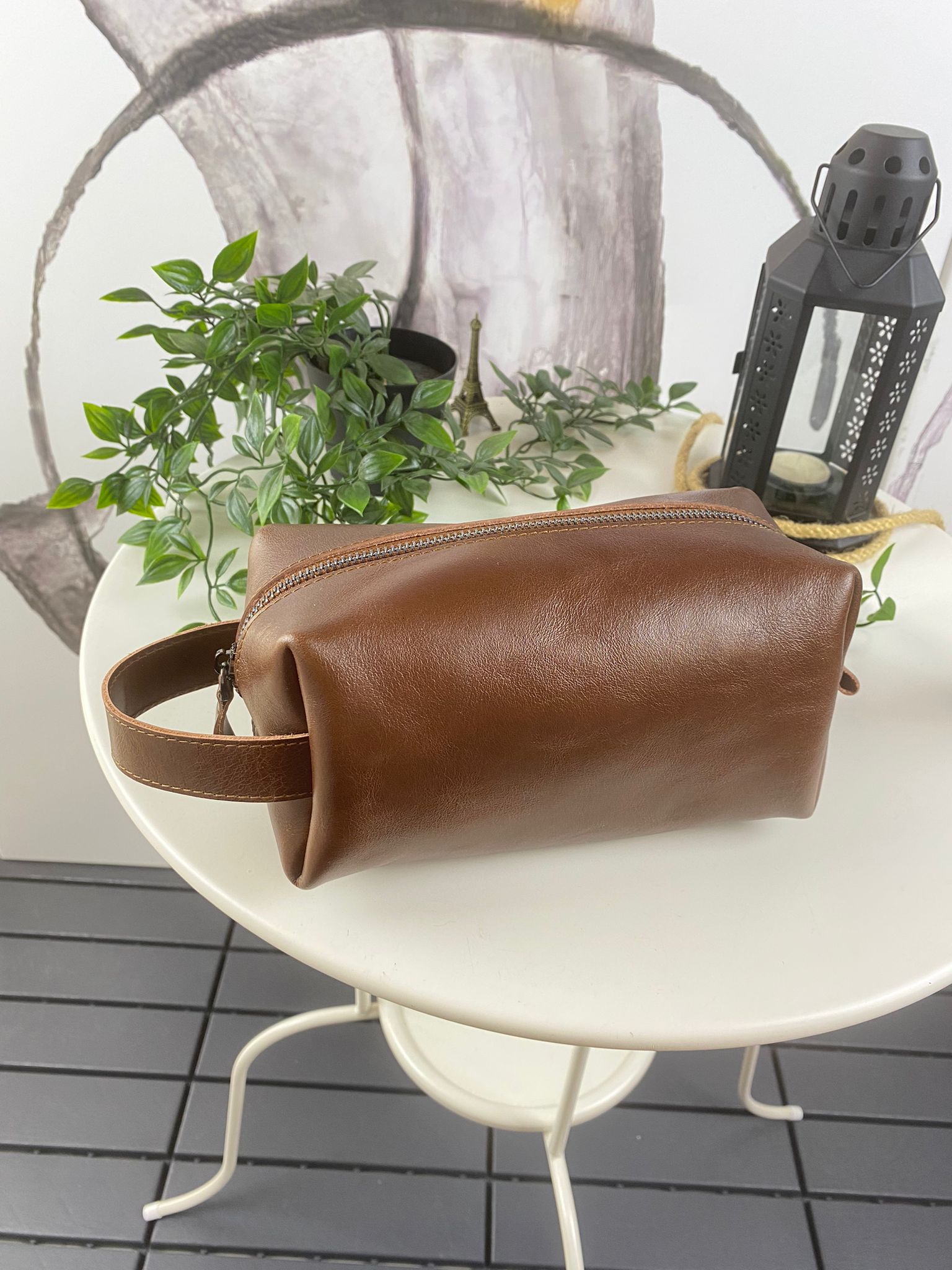 Partenon Genuine Leather Dopp Kit in various colors, showcasing its elegant design and zipper feature.