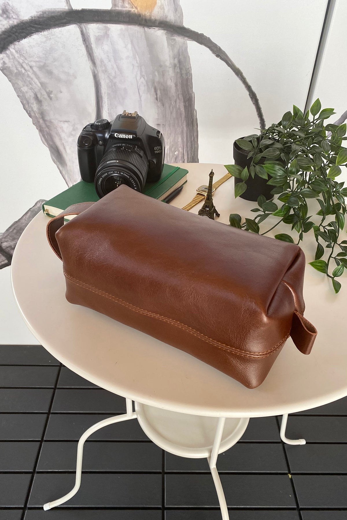 Partenon Genuine Leather Dopp Kit in various colors, showcasing its elegant design and zipper feature.