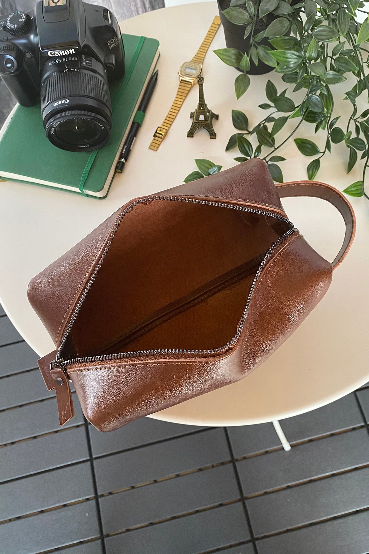 Partenon Genuine Leather Dopp Kit in various colors, showcasing its elegant design and zipper feature.