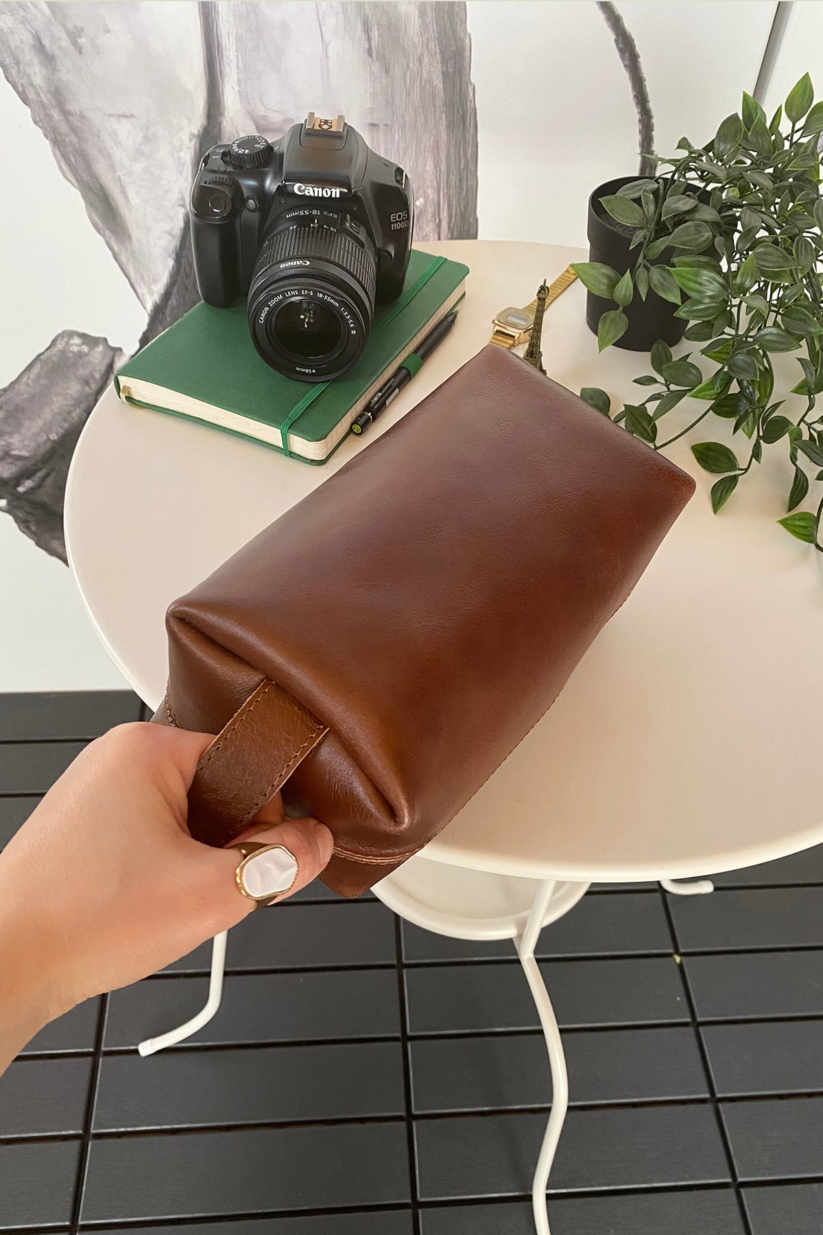 Partenon Genuine Leather Dopp Kit in various colors, showcasing its elegant design and zipper feature.