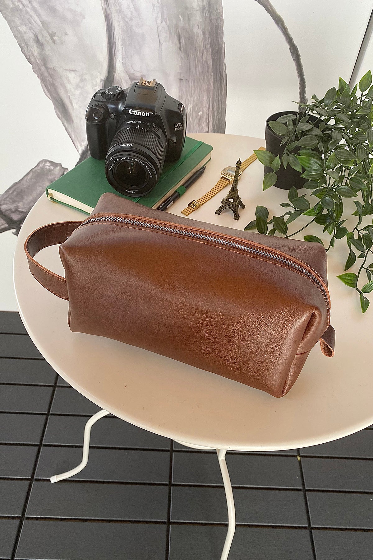 Partenon Genuine Leather Dopp Kit in various colors, showcasing its elegant design and zipper feature.