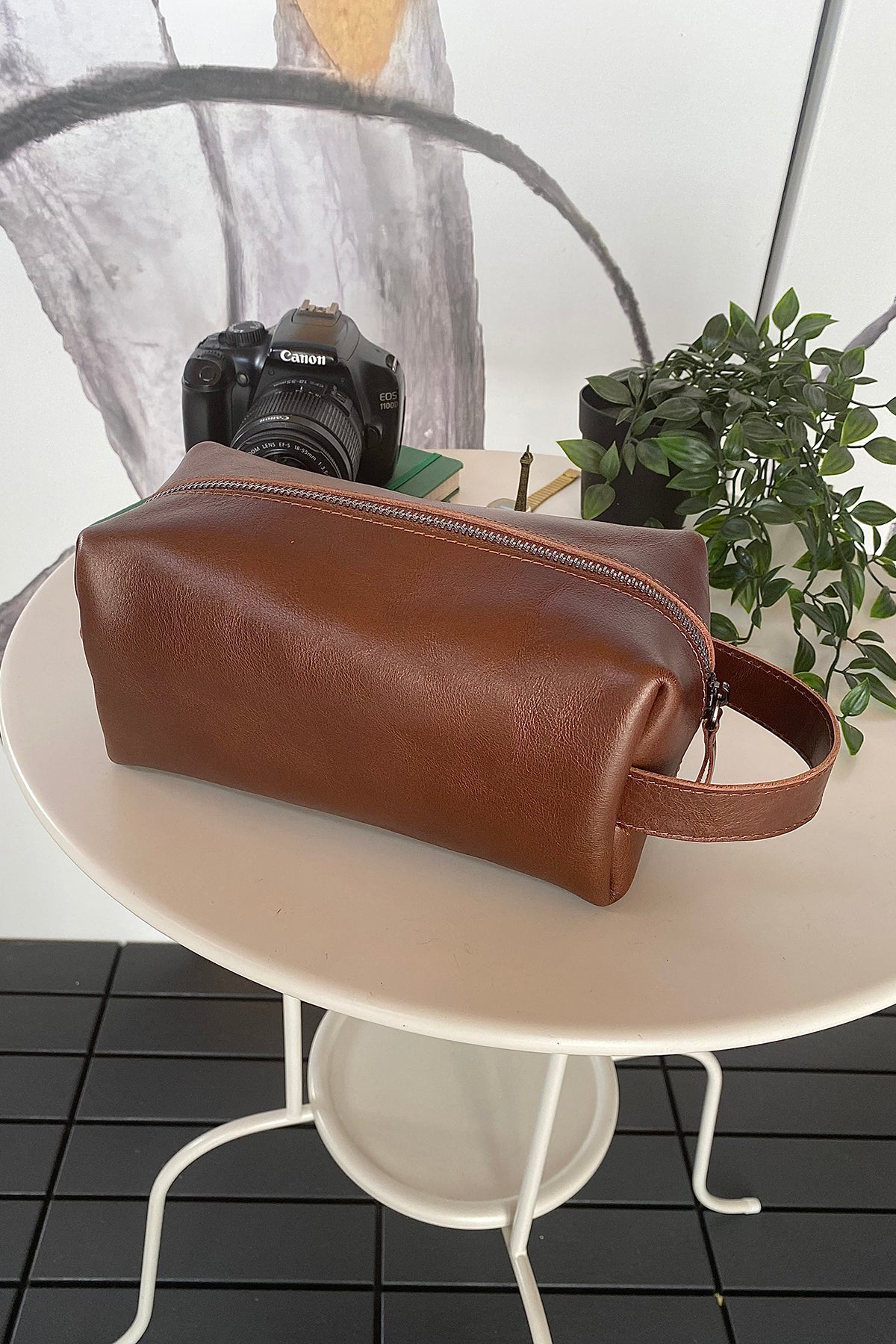 Partenon Genuine Leather Dopp Kit in various colors, showcasing its elegant design and zipper feature.