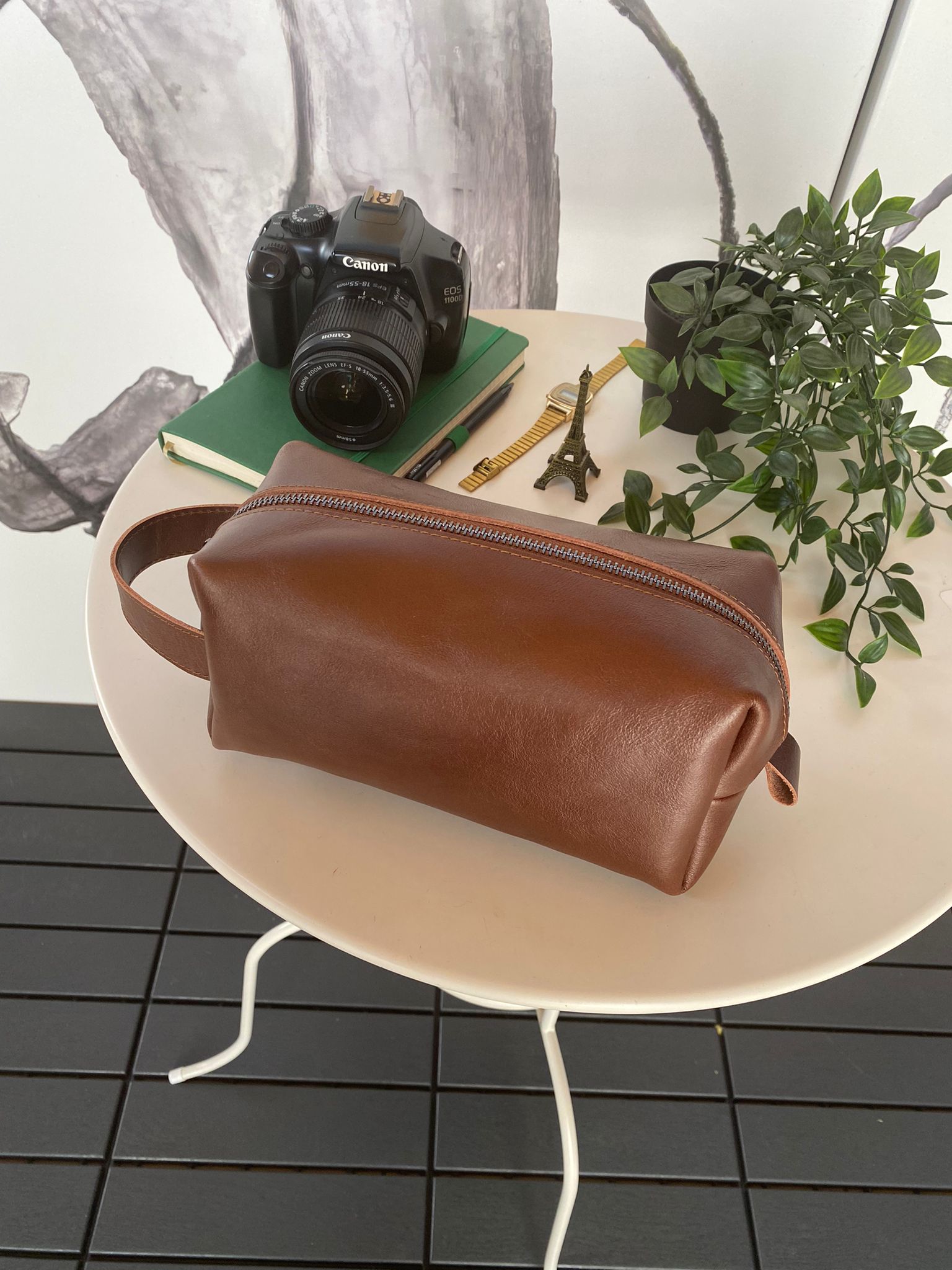 Partenon Genuine Leather Dopp Kit in various colors, showcasing its elegant design and zipper feature.