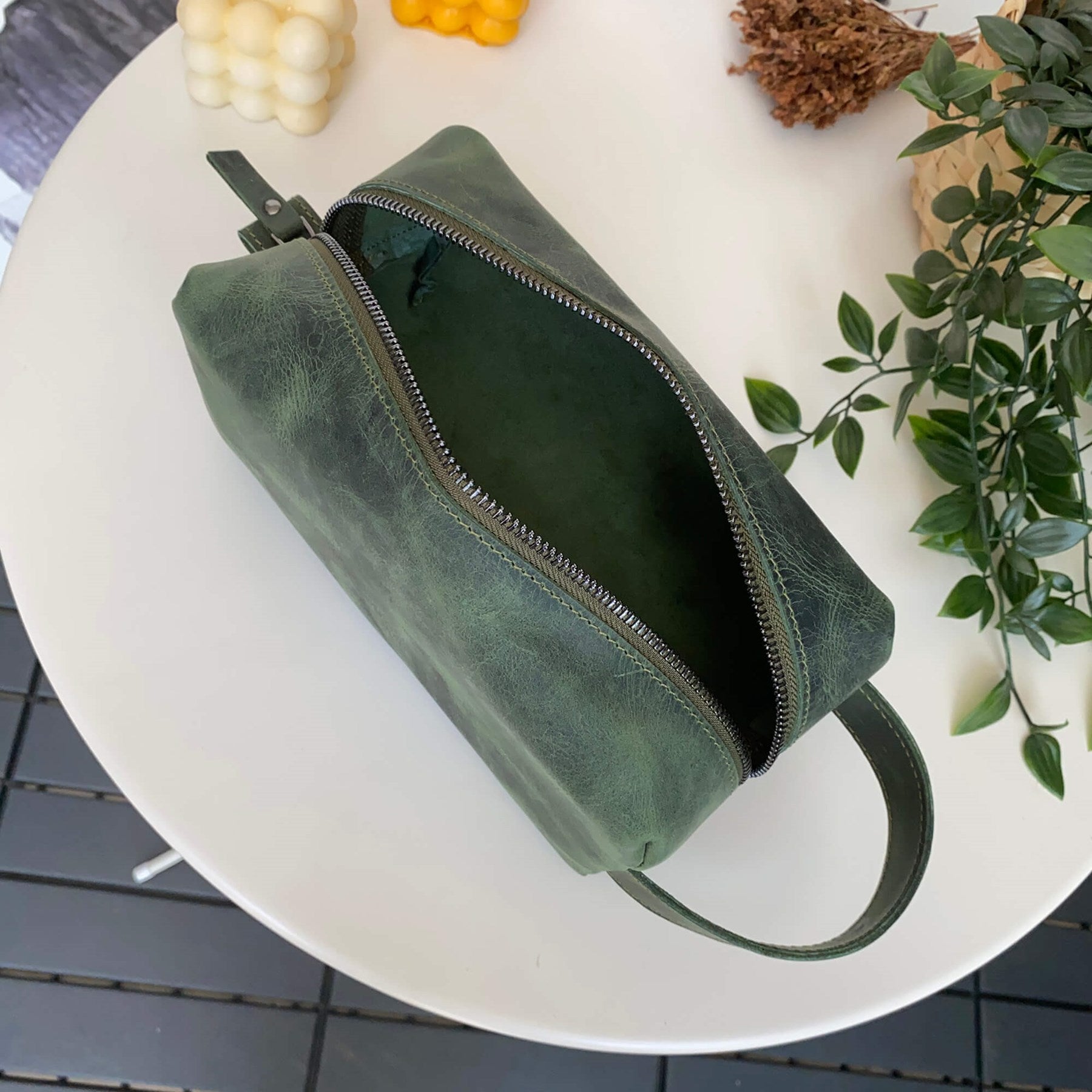 Partenon Genuine Leather Dopp Kit in various colors, showcasing its elegant design and zipper feature.