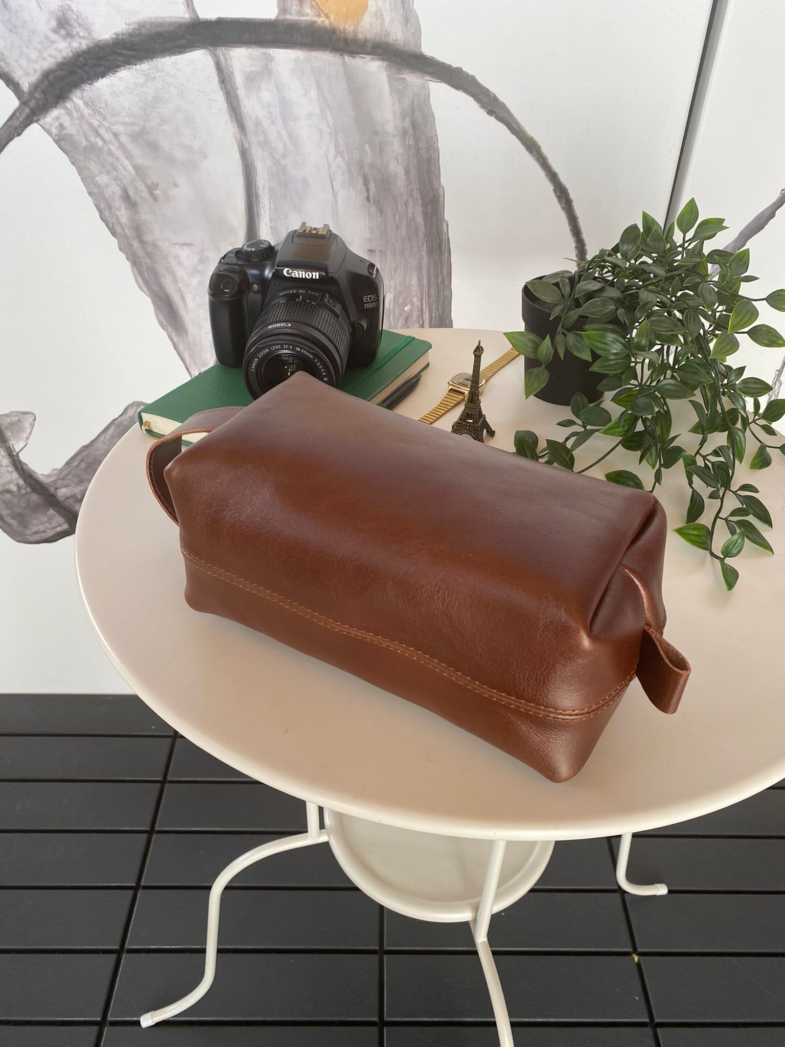 Partenon Genuine Leather Dopp Kit in various colors, showcasing its elegant design and zipper feature.