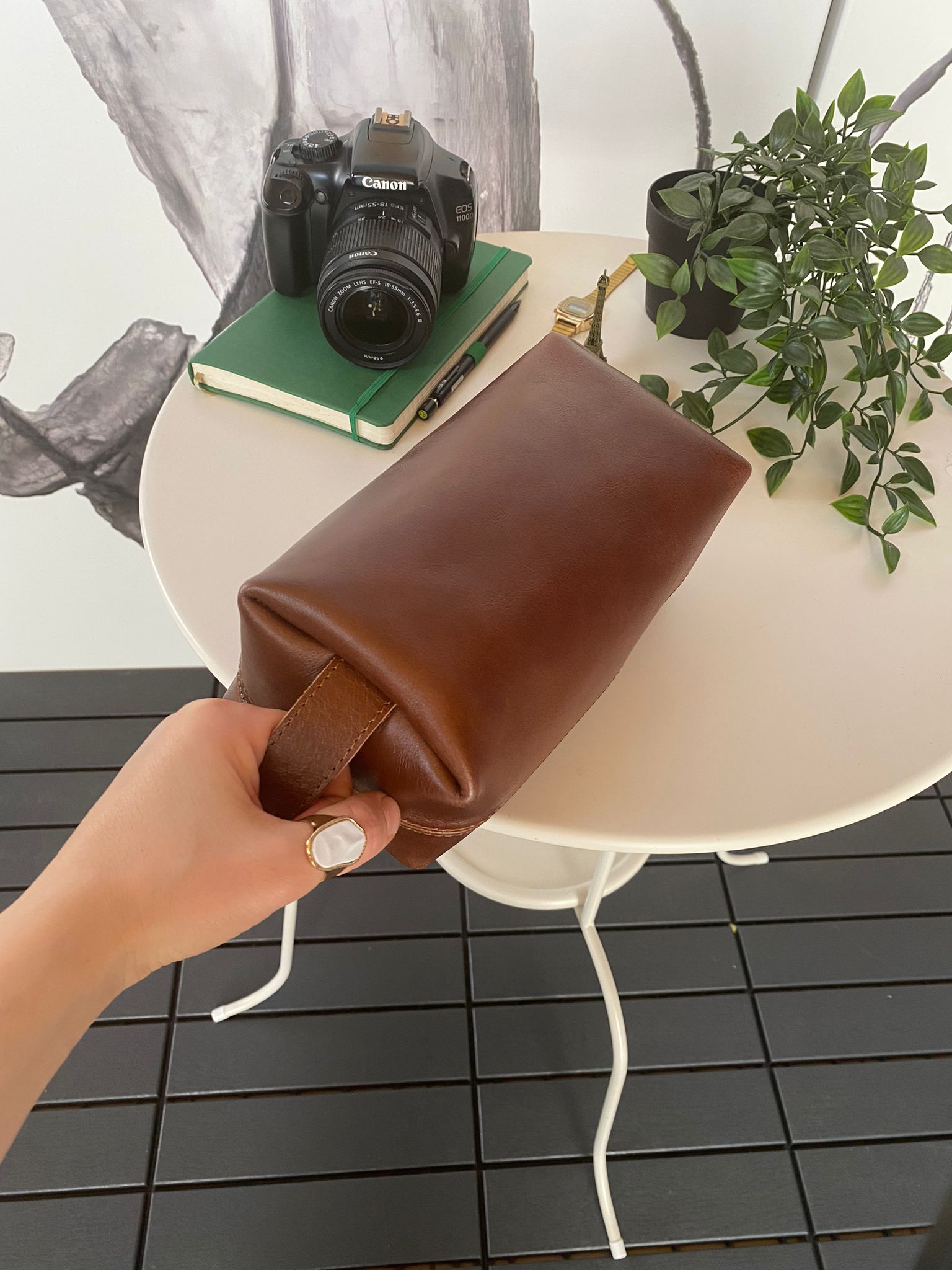 Partenon Genuine Leather Dopp Kit in various colors, showcasing its elegant design and zipper feature.