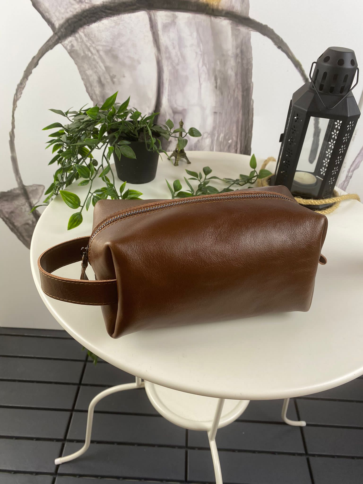 Partenon Genuine Leather Dopp Kit in various colors, showcasing its elegant design and zipper feature.