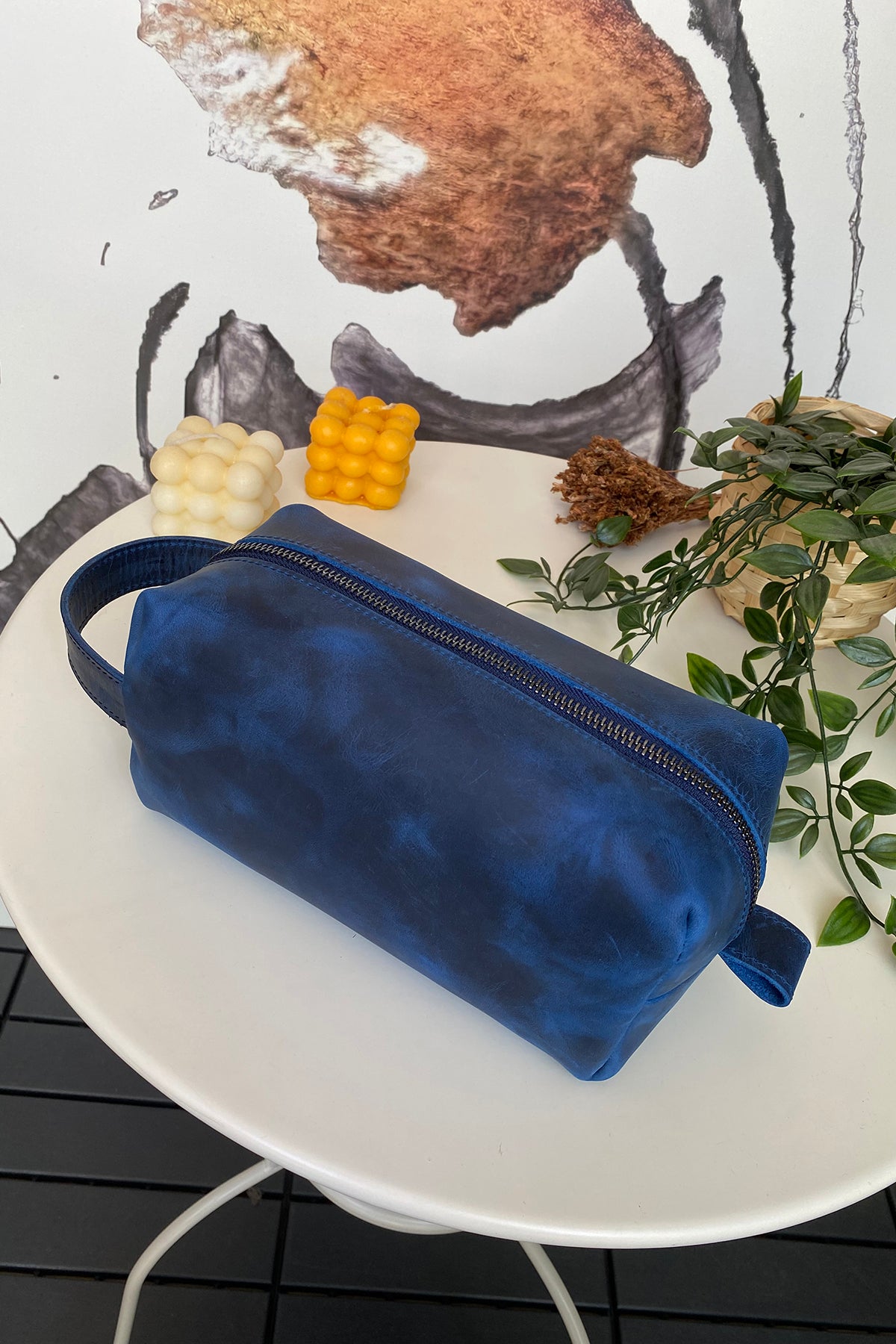 Partenon Genuine Leather Dopp Kit in various colors, showcasing its elegant design and zipper feature.