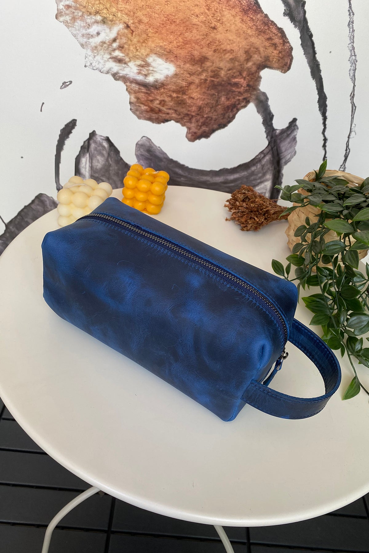 Partenon Genuine Leather Dopp Kit in various colors, showcasing its elegant design and zipper feature.