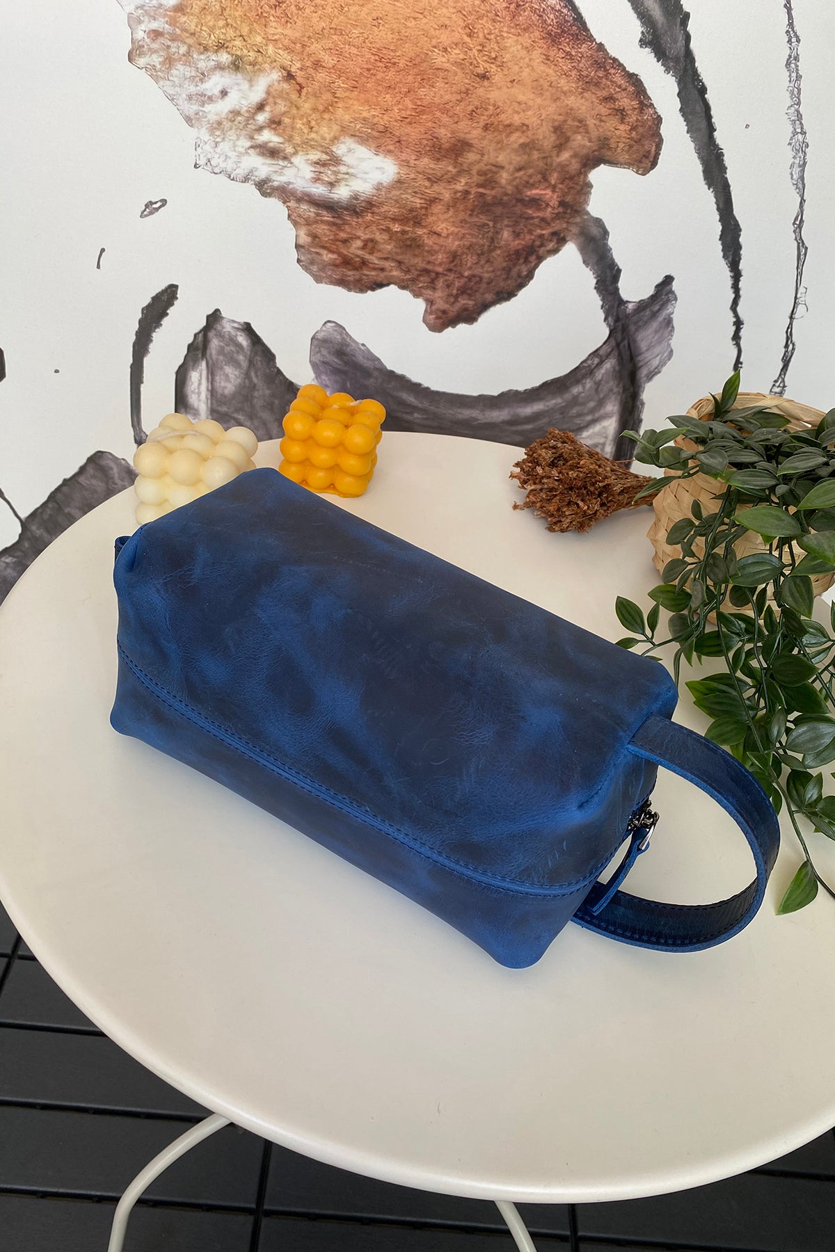 Partenon Genuine Leather Dopp Kit in various colors, showcasing its elegant design and zipper feature.