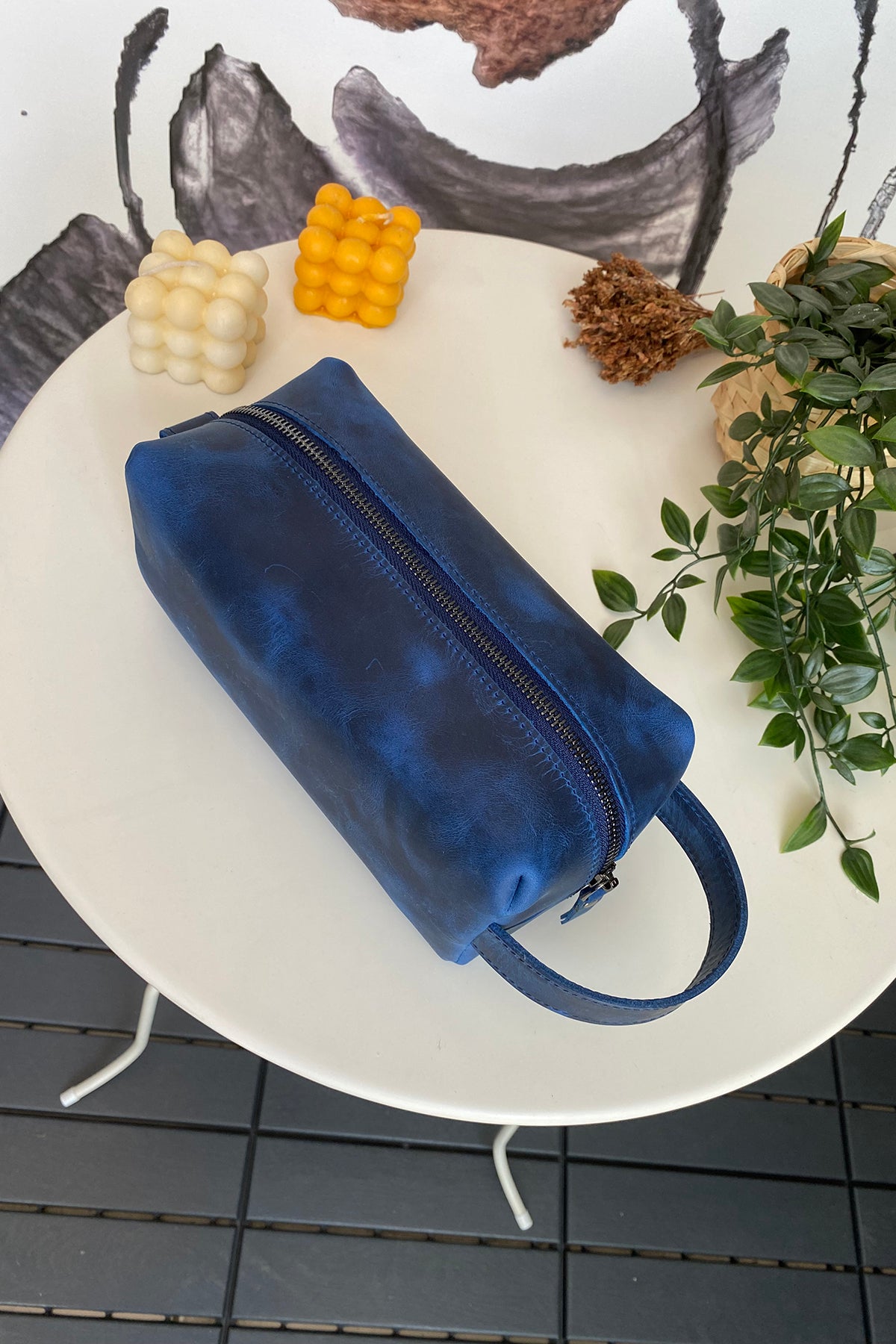 Partenon Genuine Leather Dopp Kit in various colors, showcasing its elegant design and zipper feature.