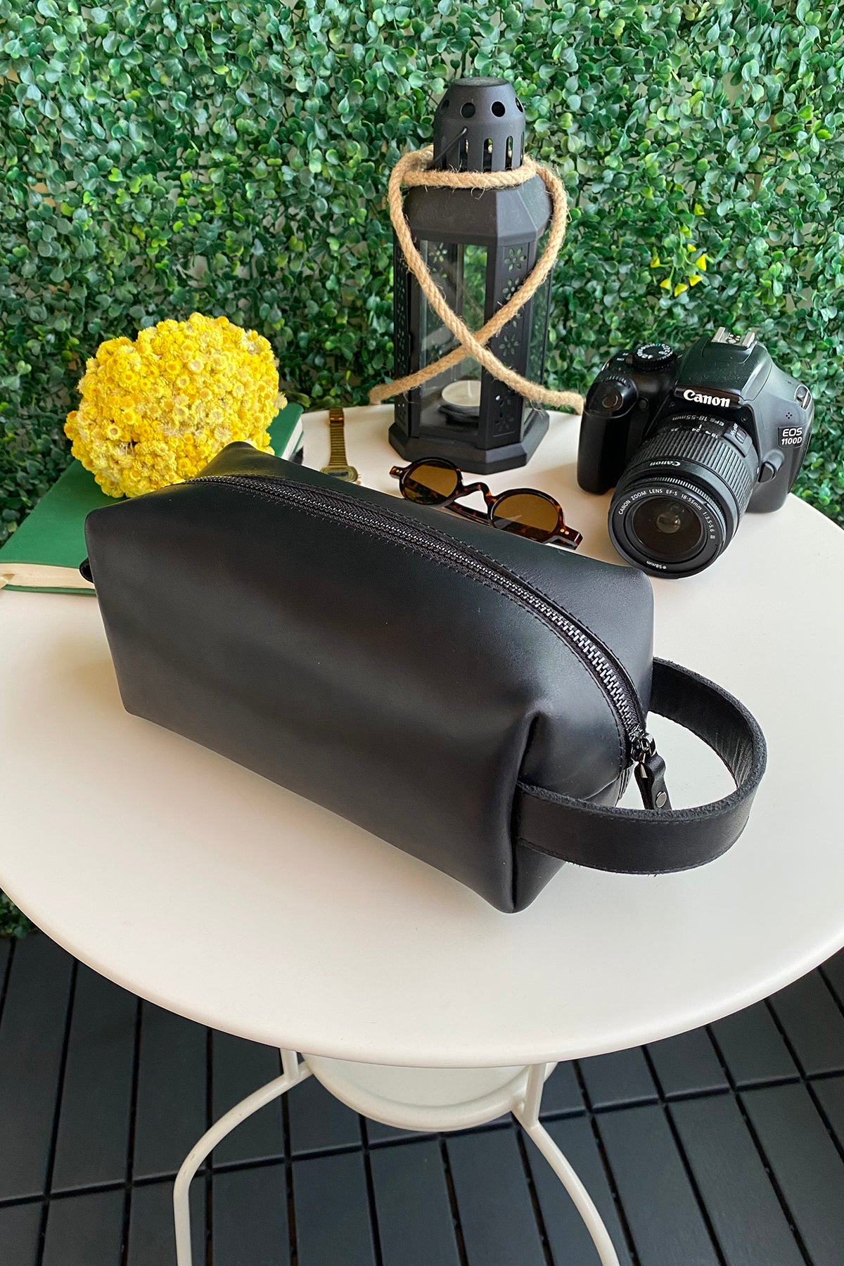 Partenon Genuine Leather Dopp Kit in various colors, showcasing its elegant design and zipper feature.