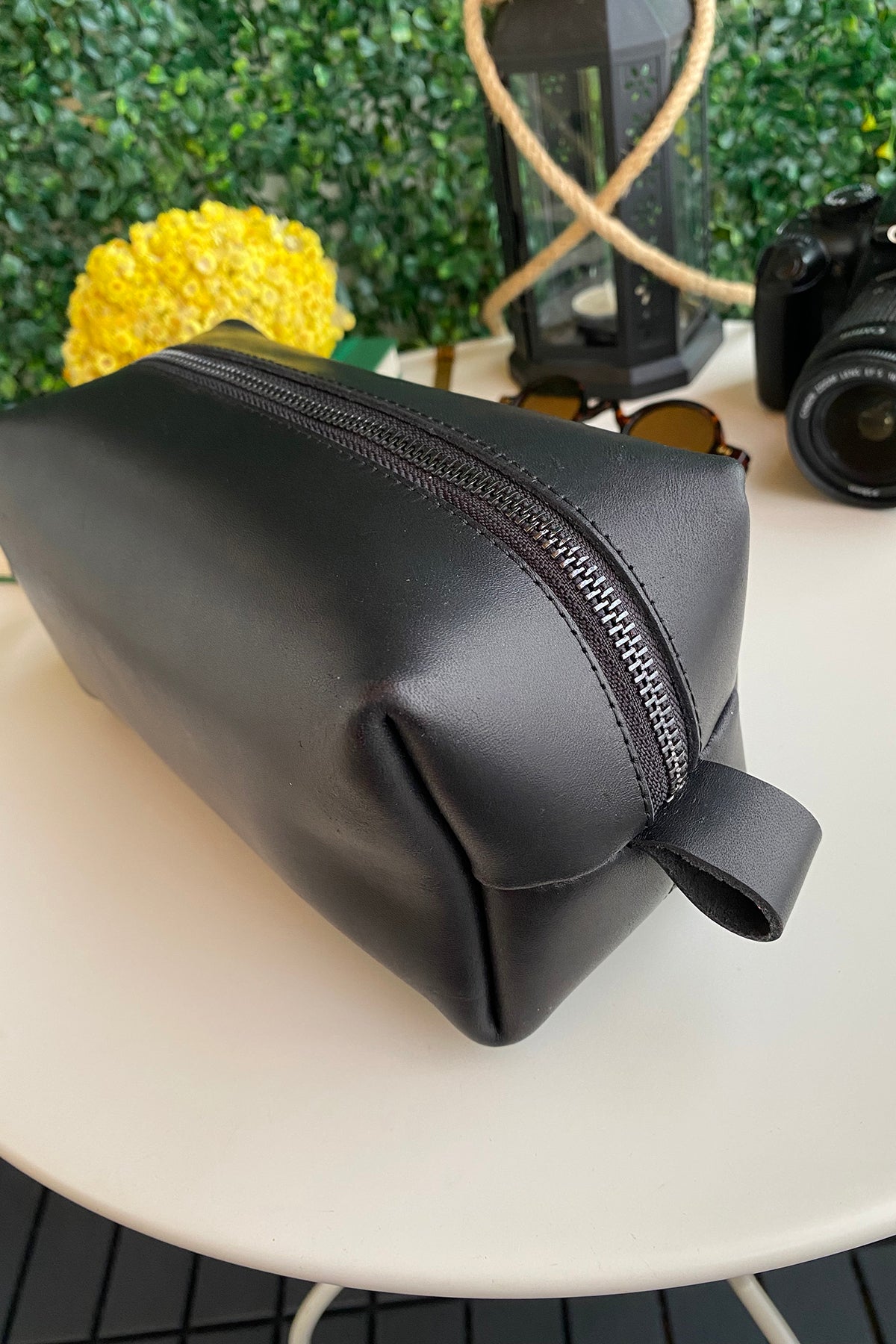 Partenon Genuine Leather Dopp Kit in various colors, showcasing its elegant design and zipper feature.