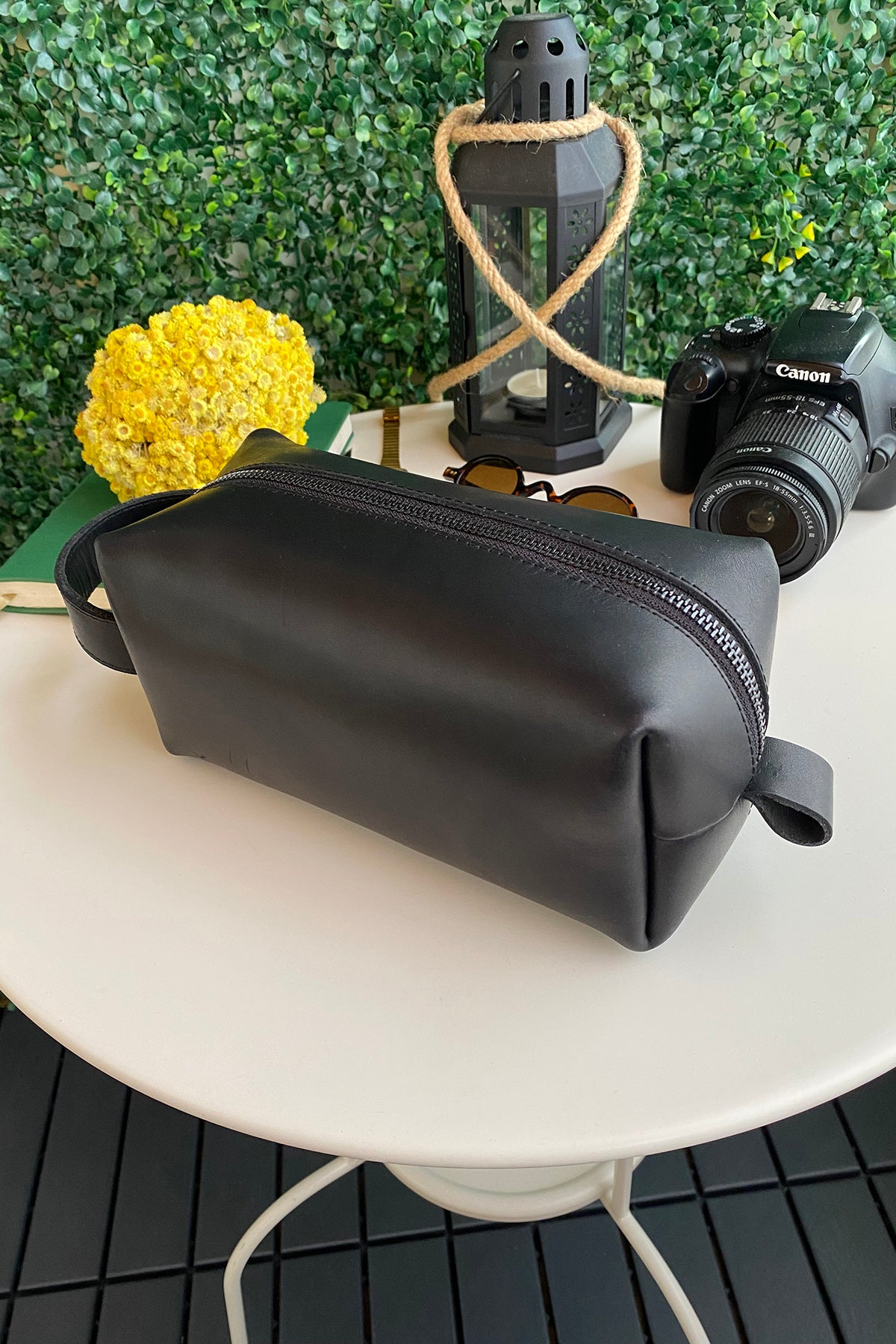 Partenon Genuine Leather Dopp Kit in various colors, showcasing its elegant design and zipper feature.