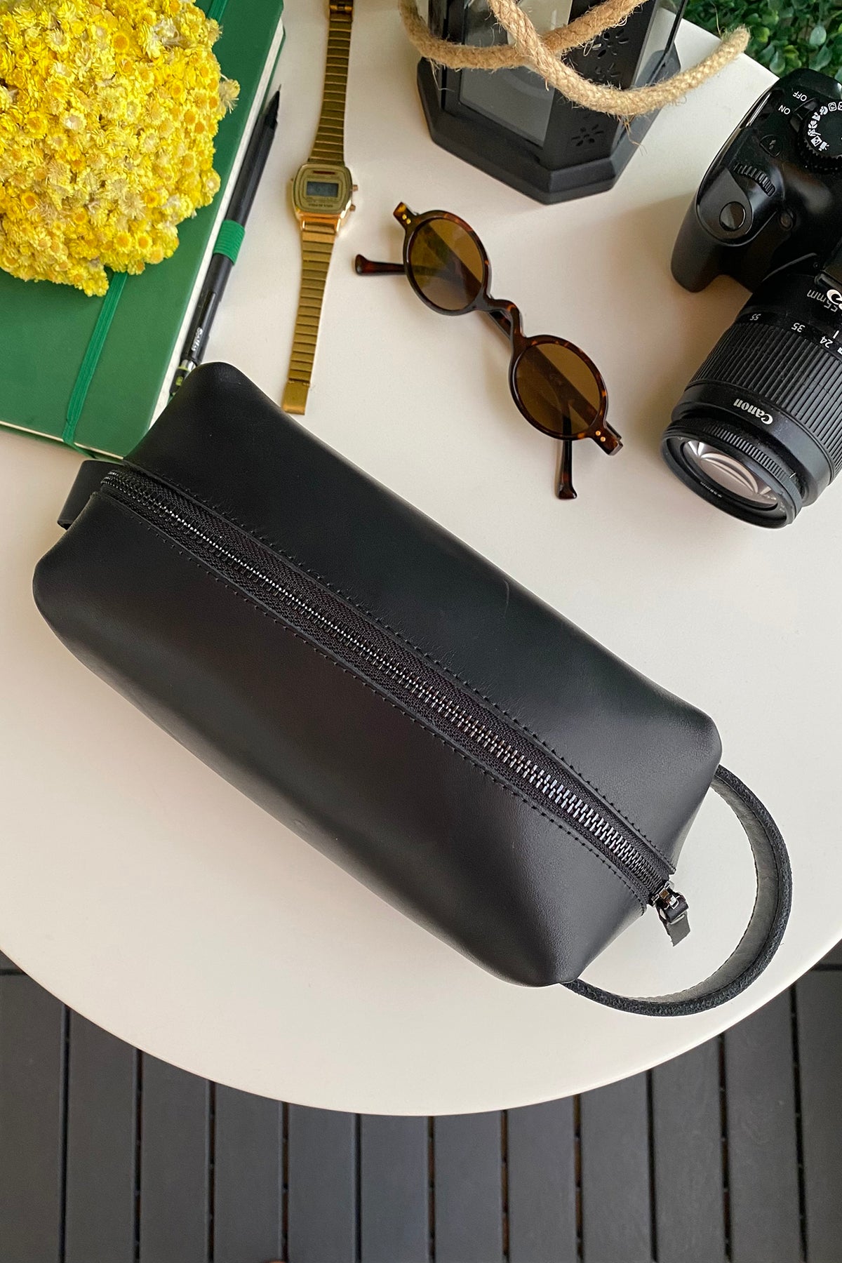 Partenon Genuine Leather Dopp Kit in various colors, showcasing its elegant design and zipper feature.