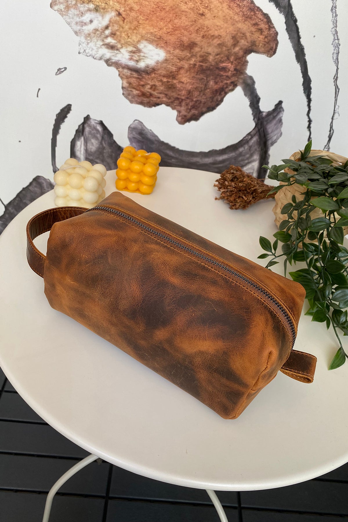 Partenon Genuine Leather Dopp Kit in various colors, showcasing its elegant design and zipper feature.