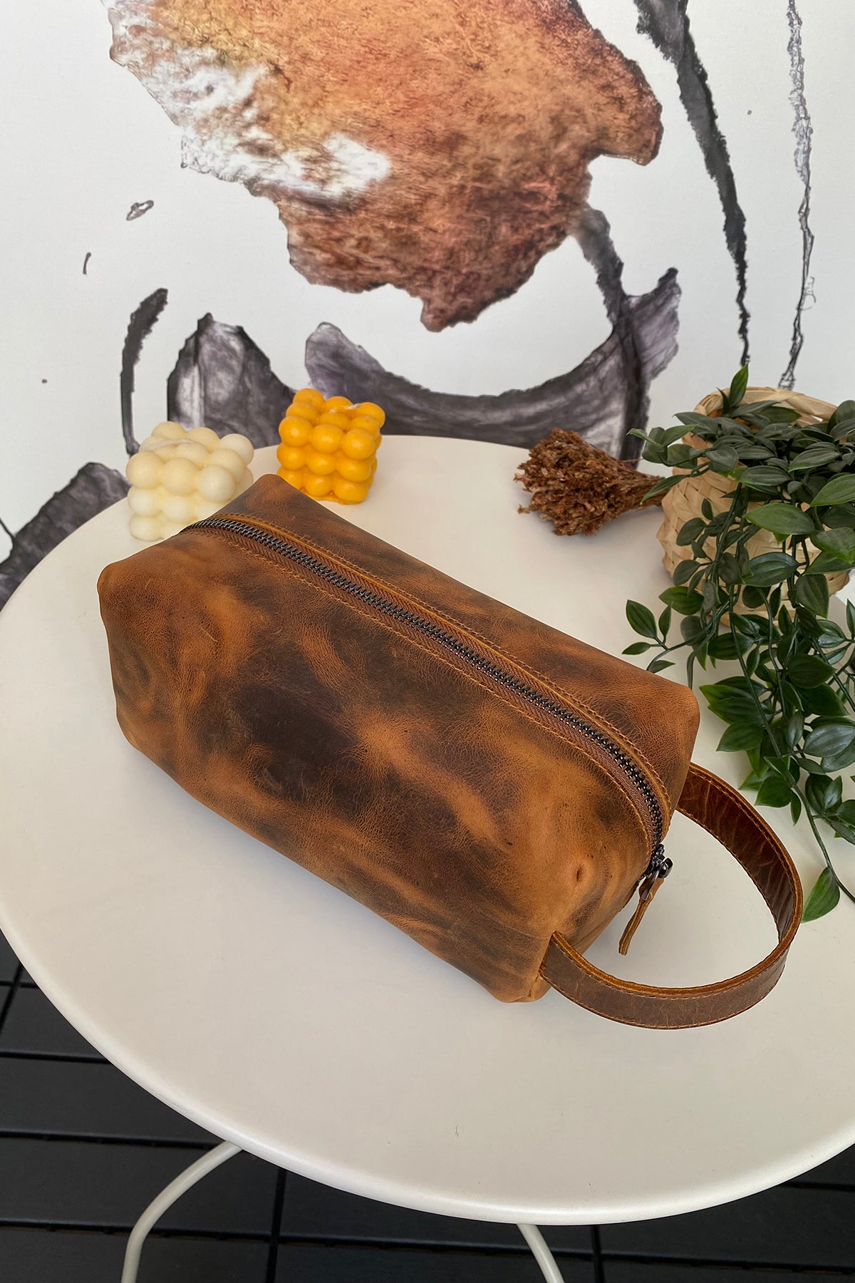 Partenon Genuine Leather Dopp Kit in various colors, showcasing its elegant design and zipper feature.