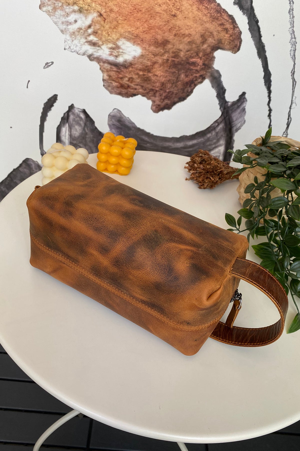 Partenon Genuine Leather Dopp Kit in various colors, showcasing its elegant design and zipper feature.