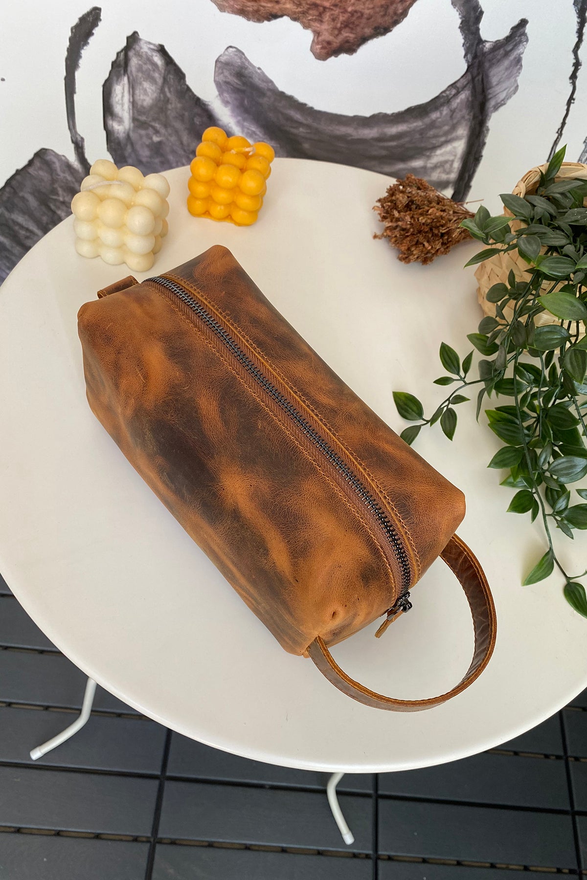 Partenon Genuine Leather Dopp Kit in various colors, showcasing its elegant design and zipper feature.