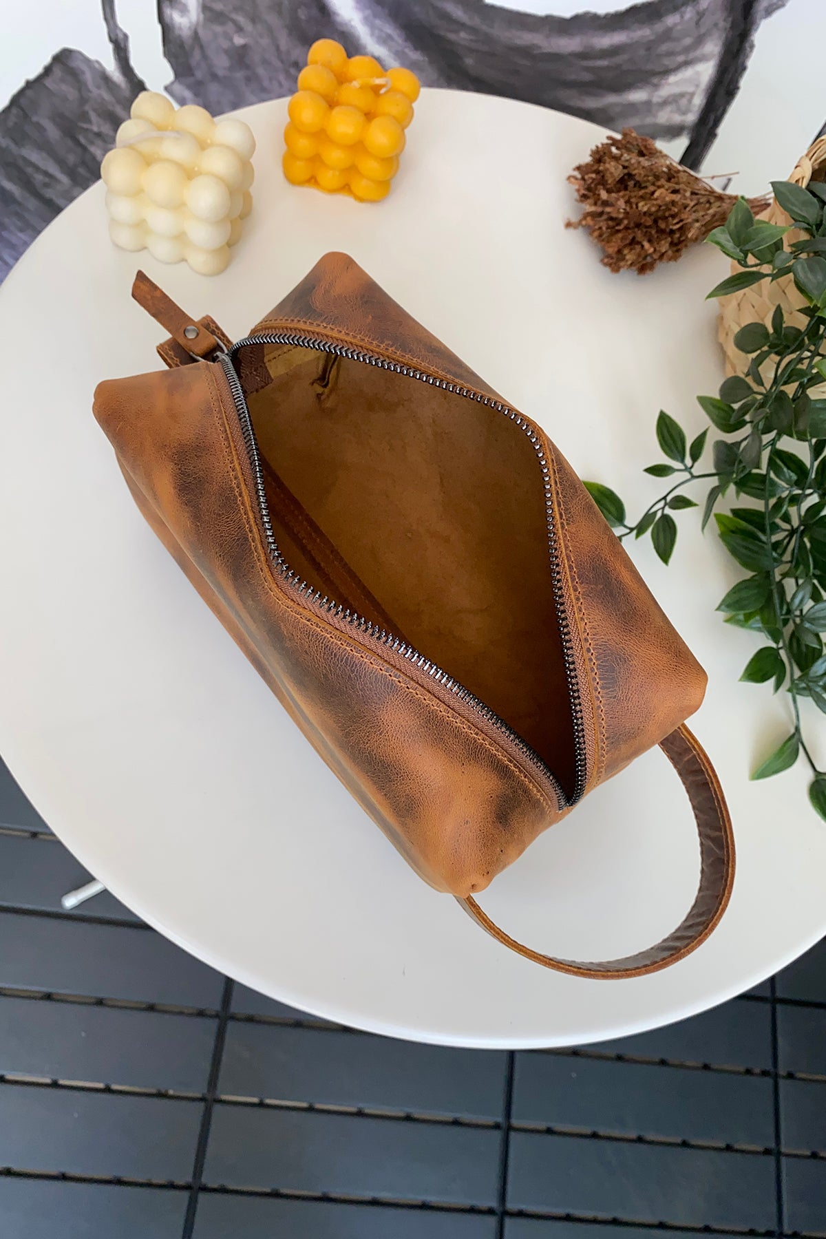 Partenon Genuine Leather Dopp Kit in various colors, showcasing its elegant design and zipper feature.