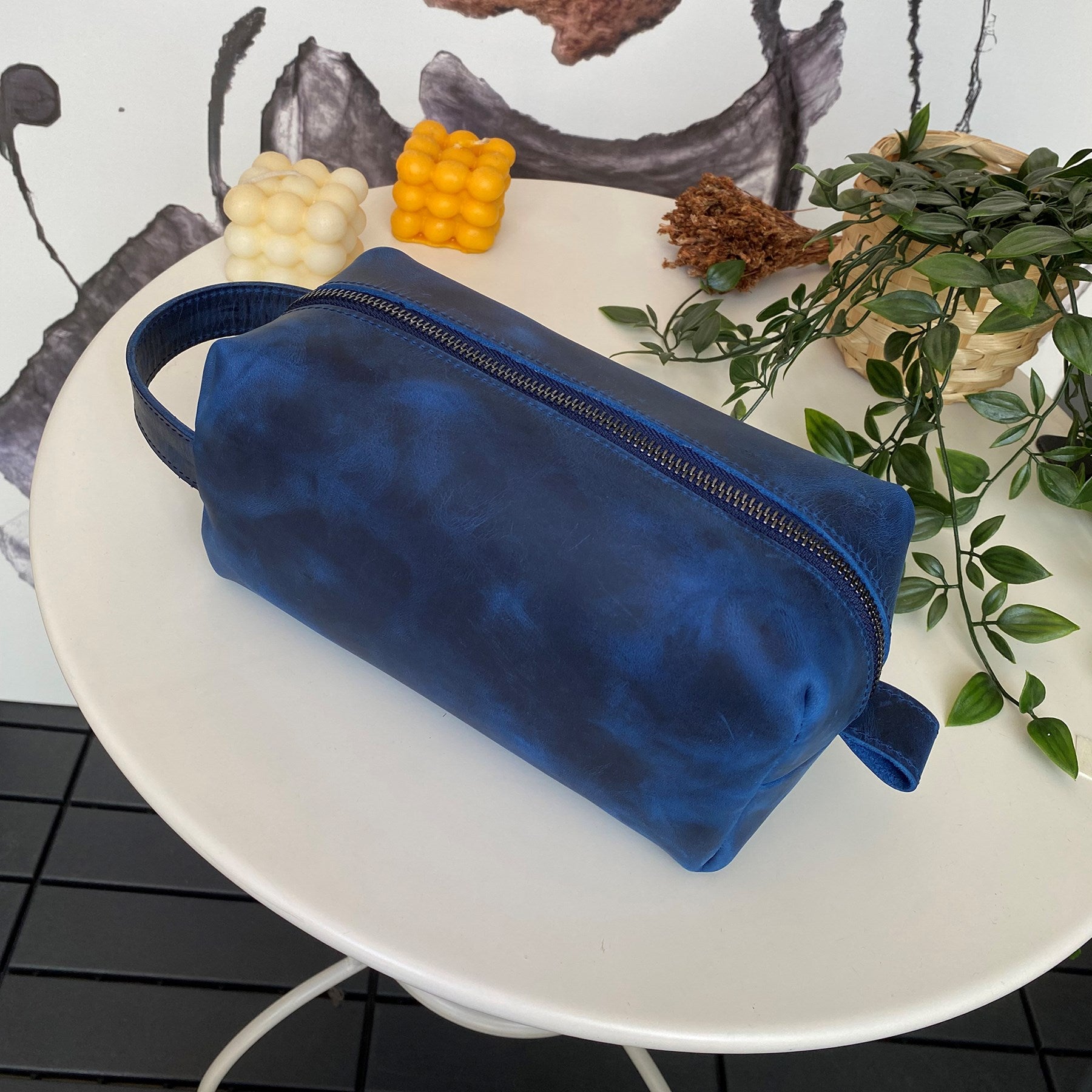 Partenon Genuine Leather Dopp Kit in various colors, showcasing its elegant design and zipper feature.