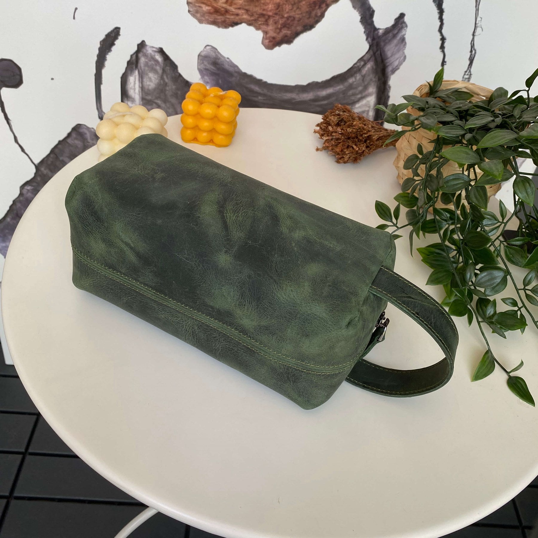 Partenon Genuine Leather Dopp Kit in various colors, showcasing its elegant design and zipper feature.