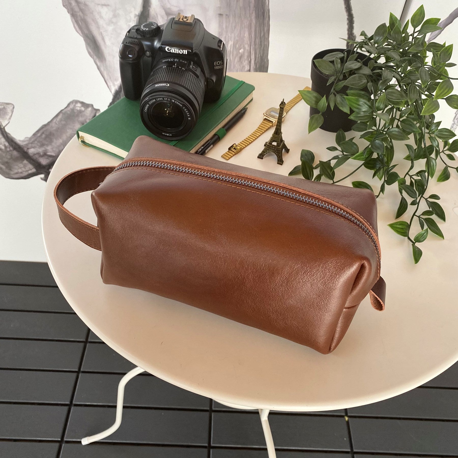 Partenon Genuine Leather Dopp Kit in various colors, showcasing its elegant design and zipper feature.