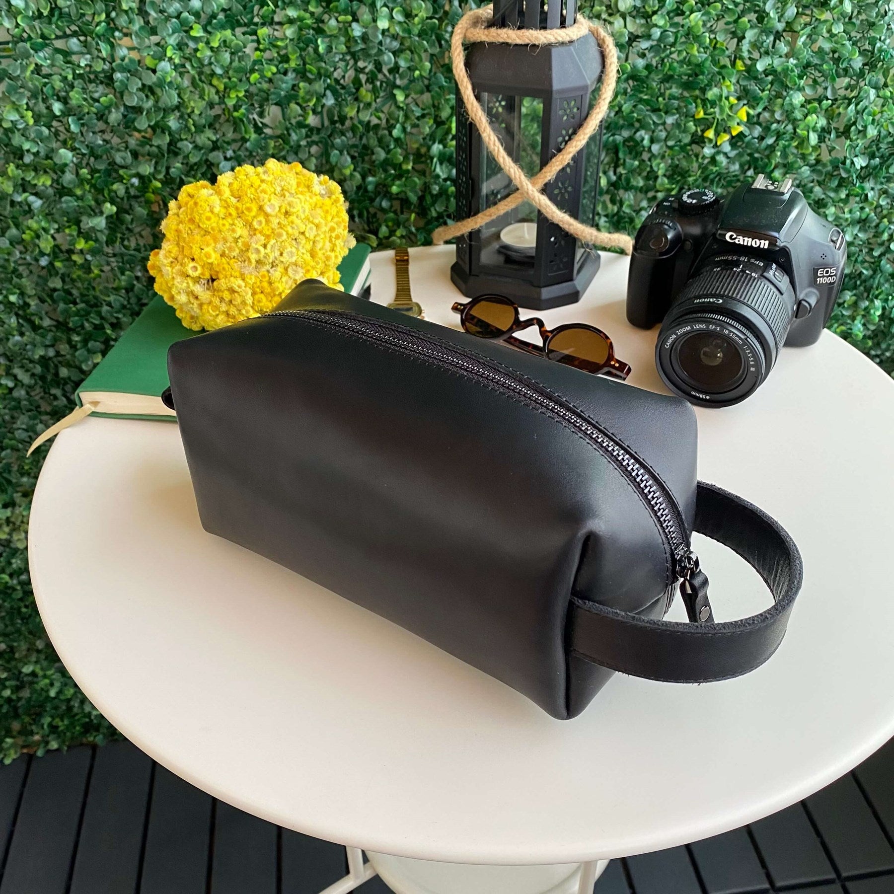 Partenon Genuine Leather Dopp Kit in various colors, showcasing its elegant design and zipper feature.