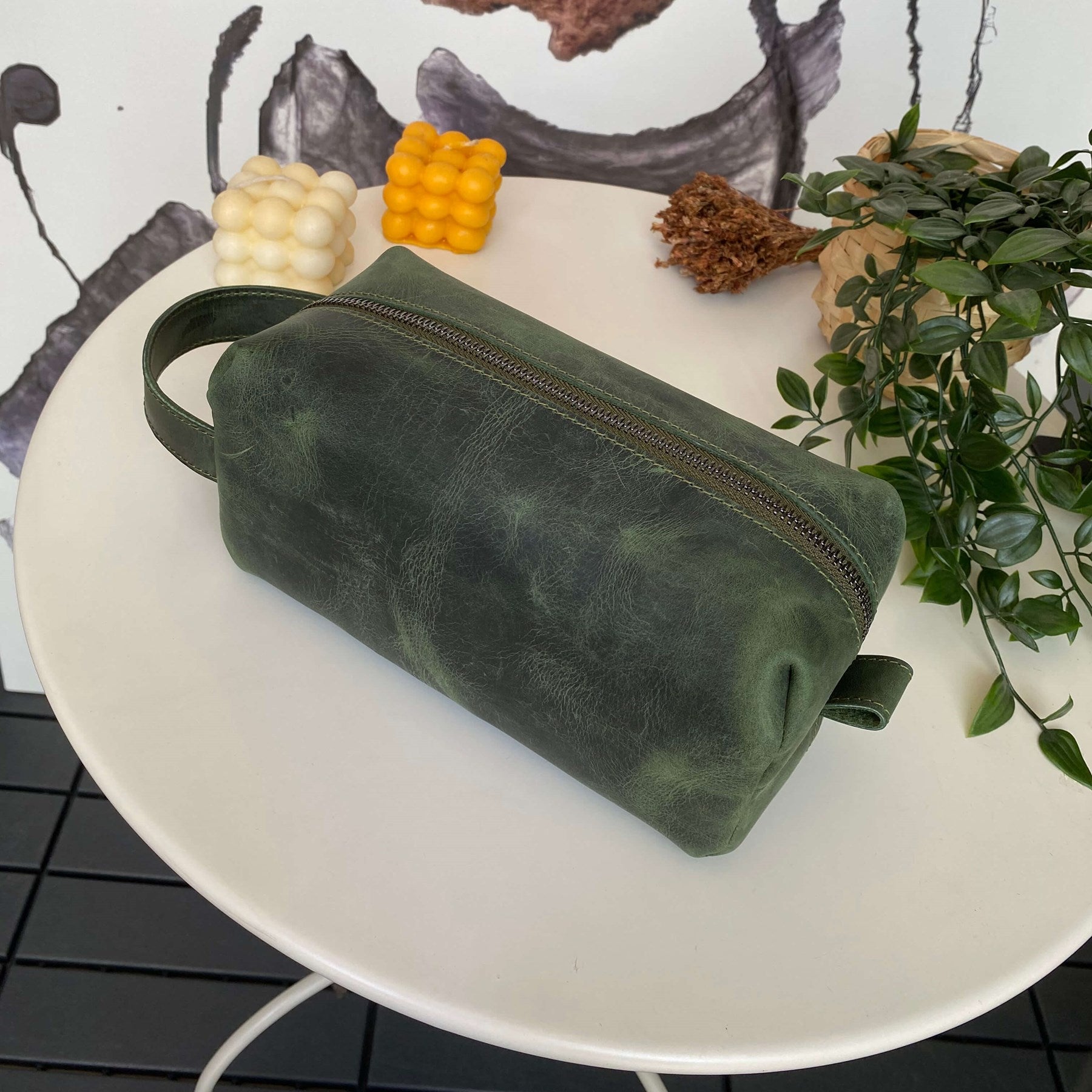 Partenon Genuine Leather Dopp Kit in various colors, showcasing its elegant design and zipper feature.