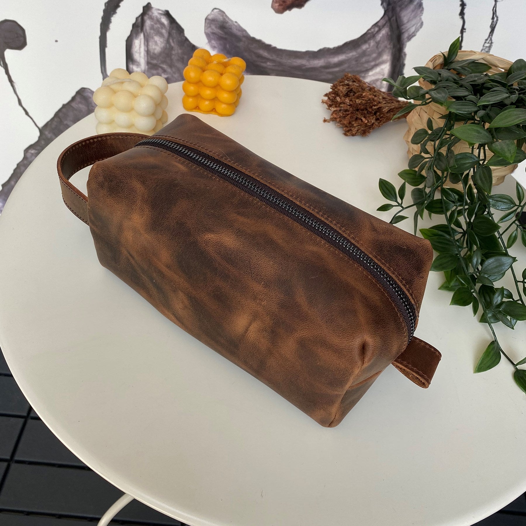 Partenon Genuine Leather Dopp Kit in various colors, showcasing its elegant design and zipper feature.