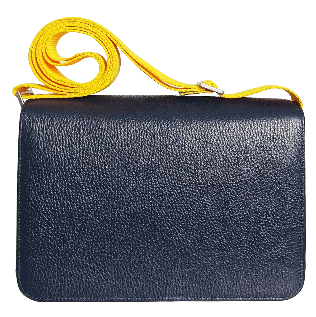 A stylish blue pebbled leather crossbody bag with a magnetic flap closure and a contrasting wide vinyl strap, showcasing its elegant design and craftsmanship.
