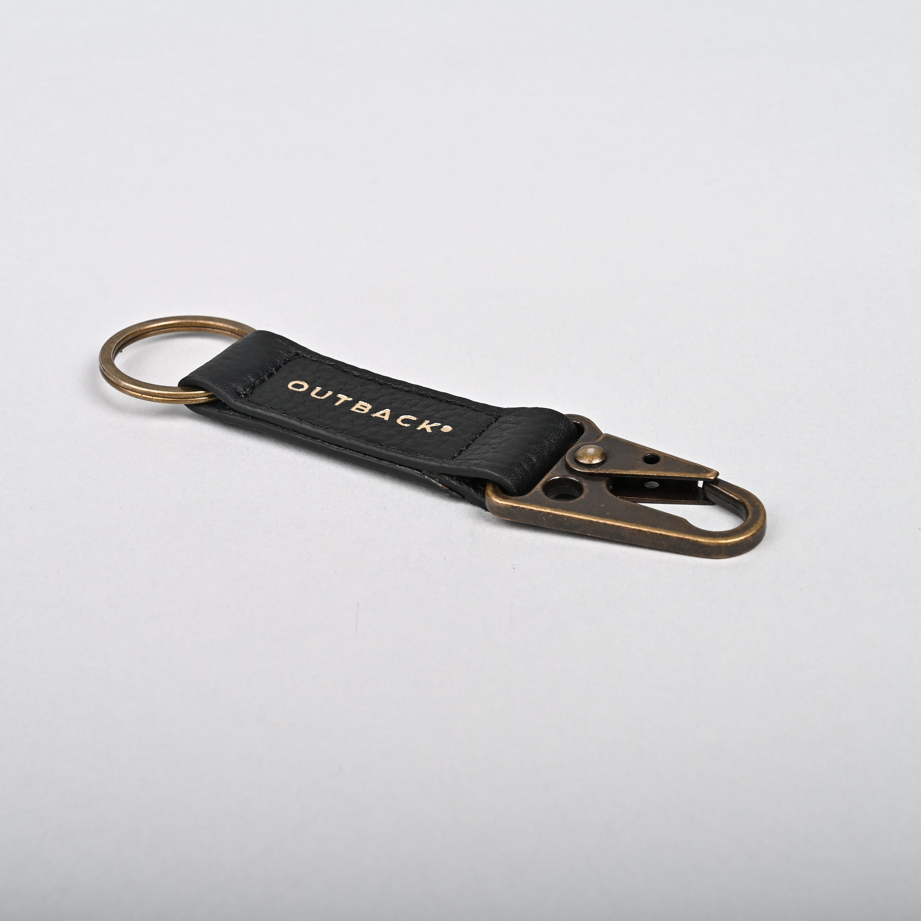 Performance Key Holder made from premium leather with antique brass hardware, showcasing its elegant design and craftsmanship.