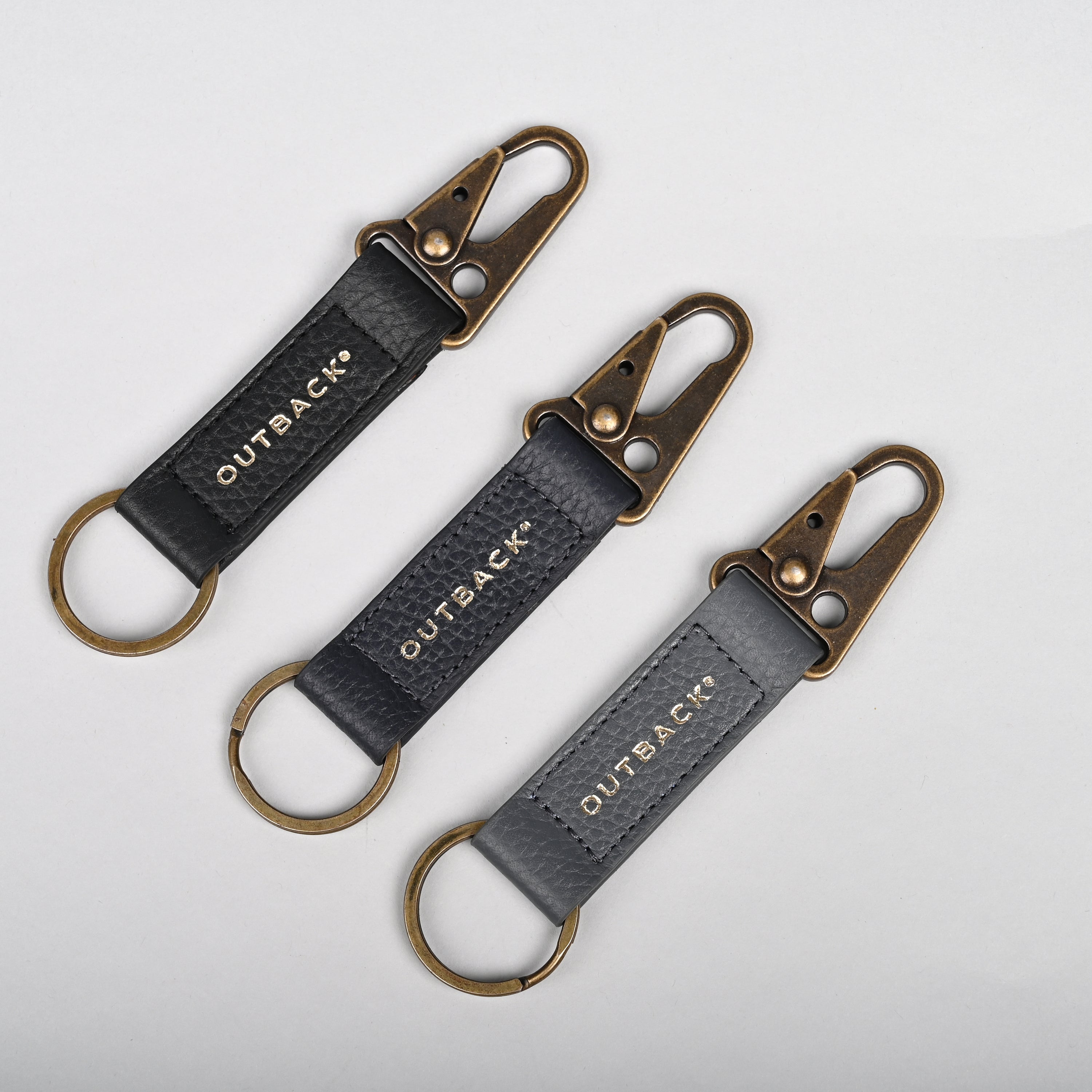 Performance Key Holder made from premium leather with antique brass hardware, showcasing its elegant design and craftsmanship.