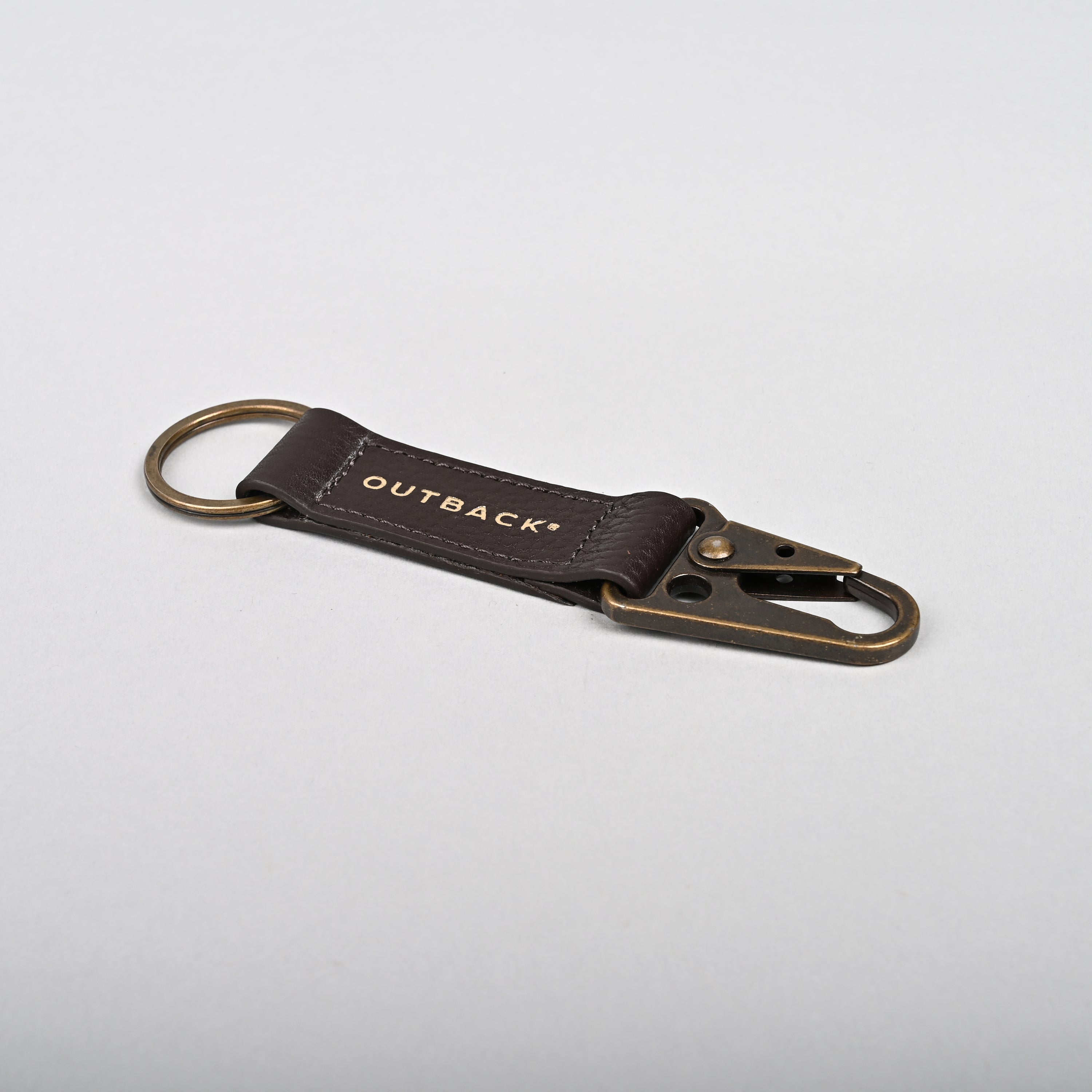 Performance Key Holder made from premium leather with antique brass hardware, featuring a snap hook mechanism.