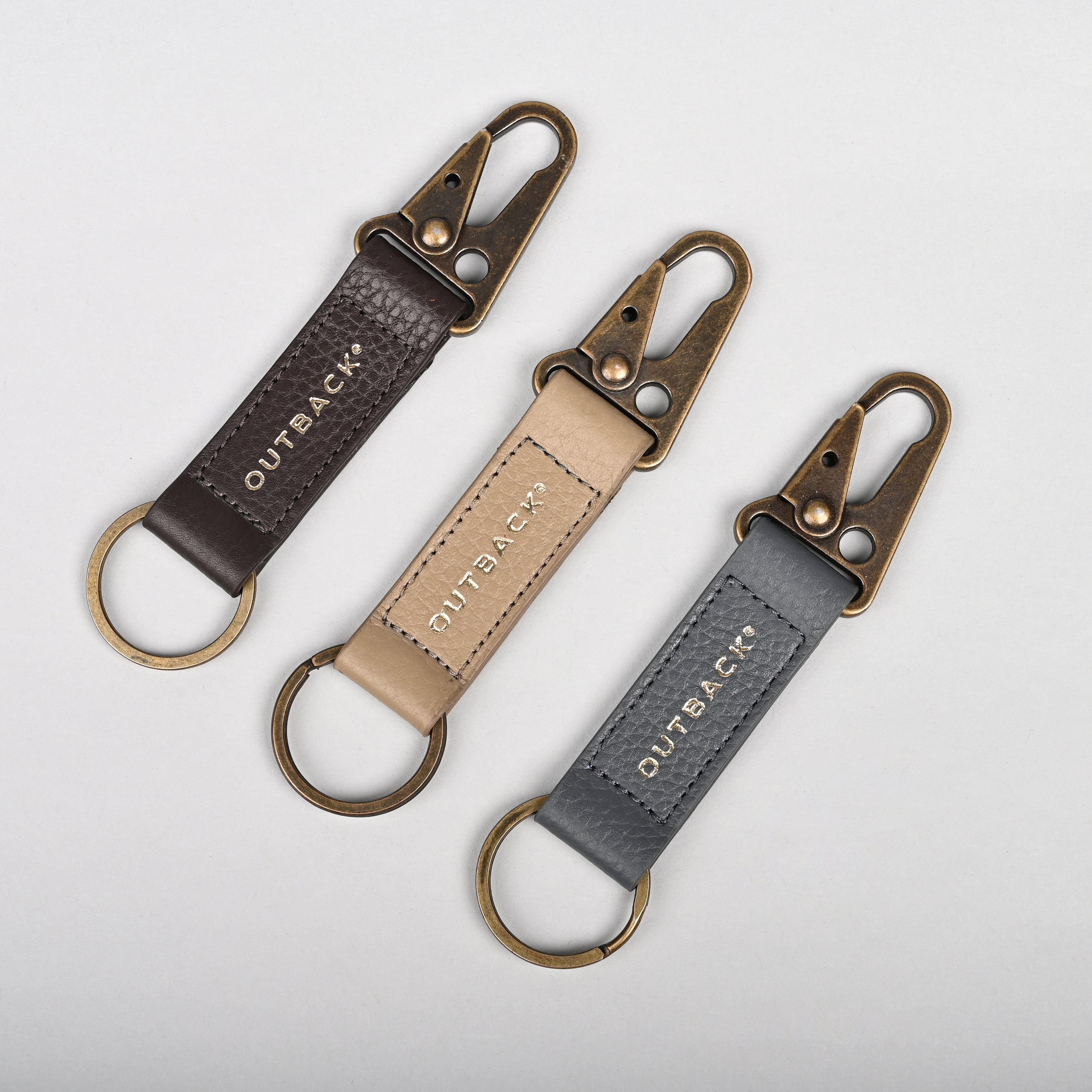 Performance Key Holder made from premium leather with antique brass hardware, featuring a snap hook mechanism.