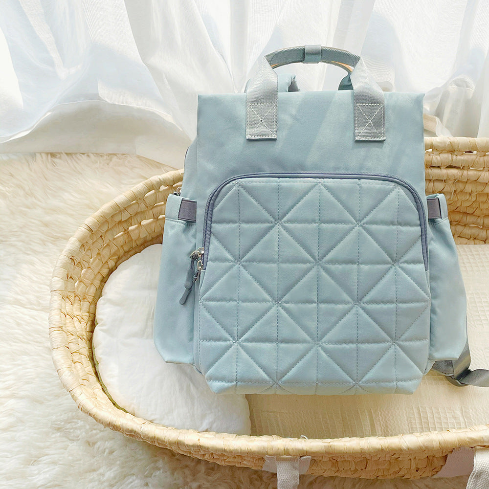 A stylish Portable Shoulder Multifunctional Bag for Mommy, showcasing its spacious design and durable Oxford material, perfect for carrying baby essentials.