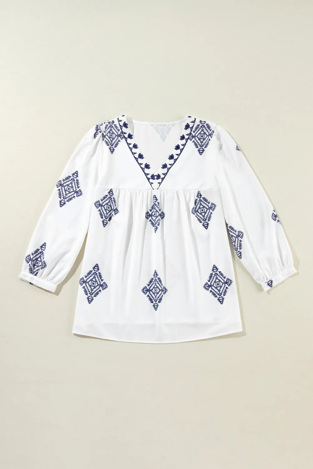 A stylish Printed V-Neck Three-Quarter Sleeve Blouse featuring a modern print, perfect for casual or dressy occasions.