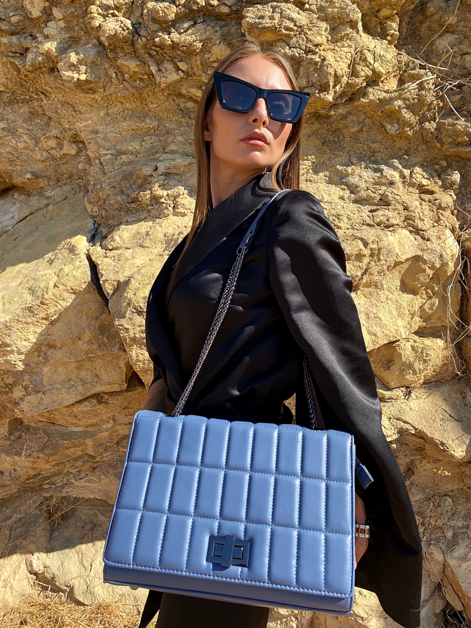 Quilted chain strap shoulder bag in green, pink, and blue colors with a stylish design and metal closure.